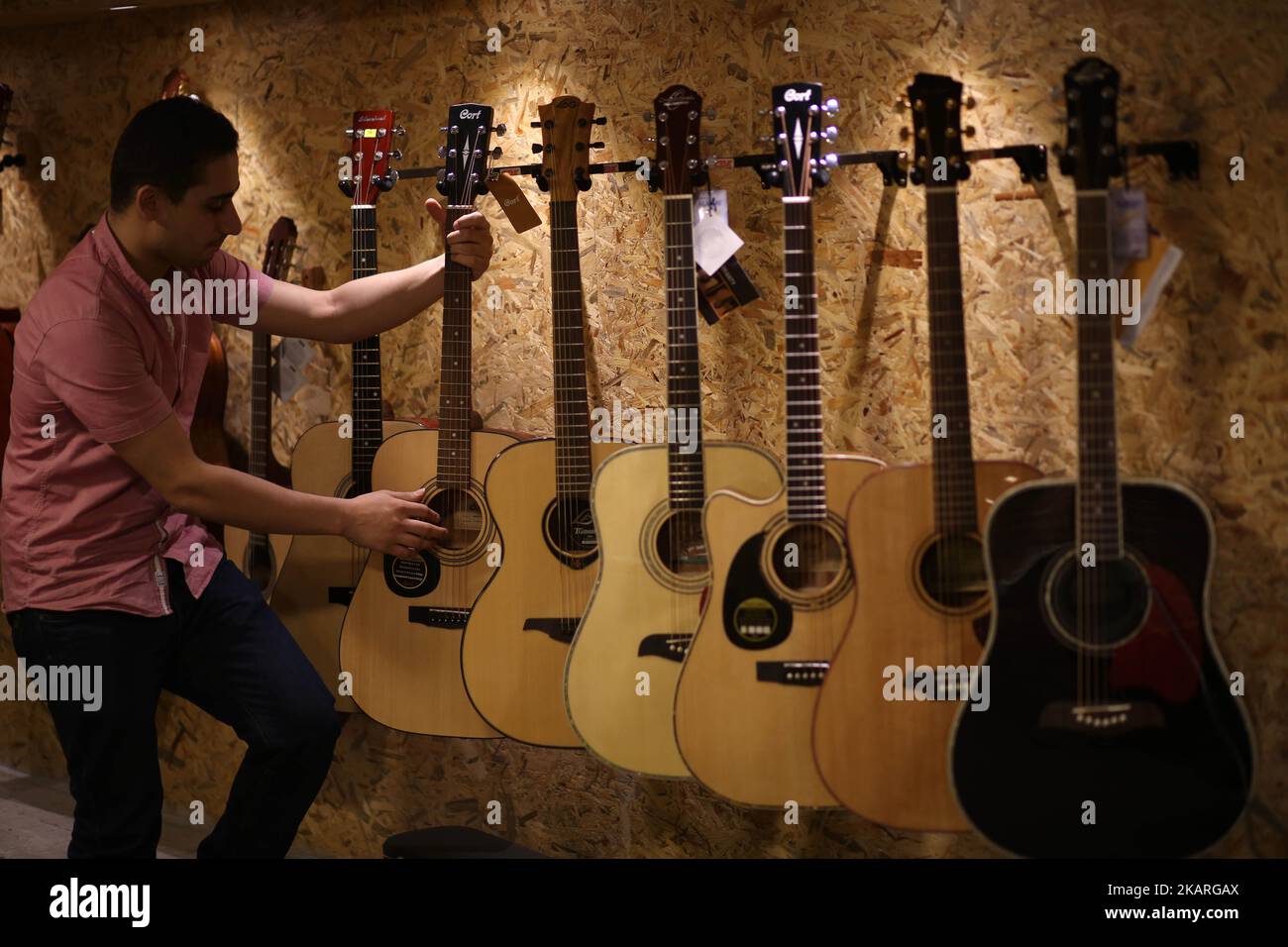 A Palestinian who works in the JARU Electronics Shop selling musical