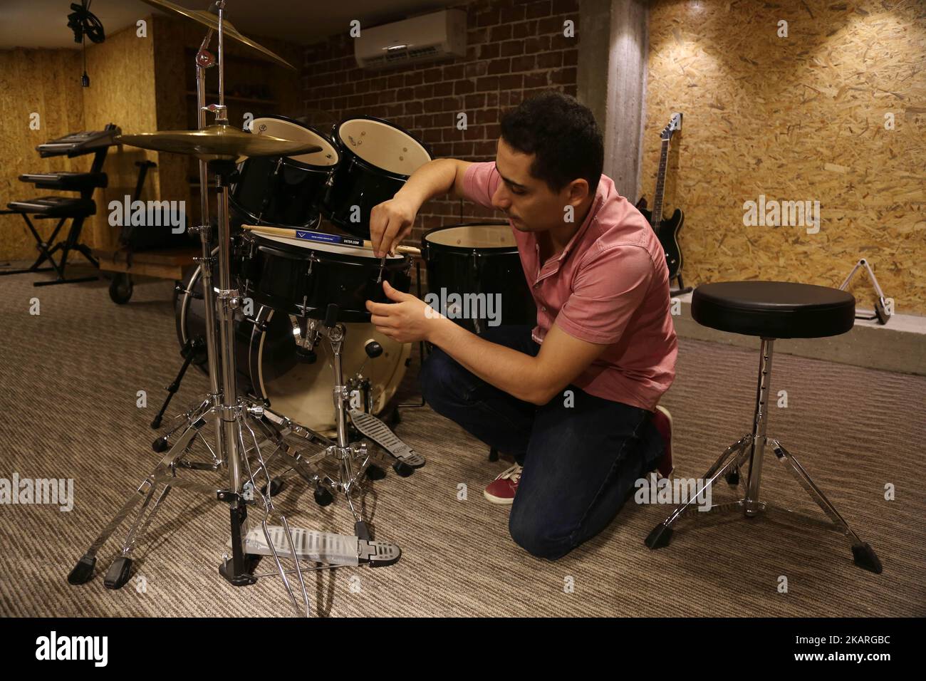 A Palestinian who works in the JARU Electronics Shop selling musical