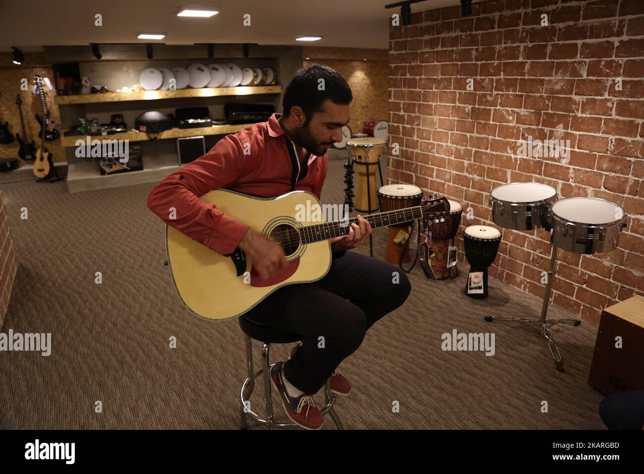 A Palestinian who works in the JARU Electronics Shop selling musical ...