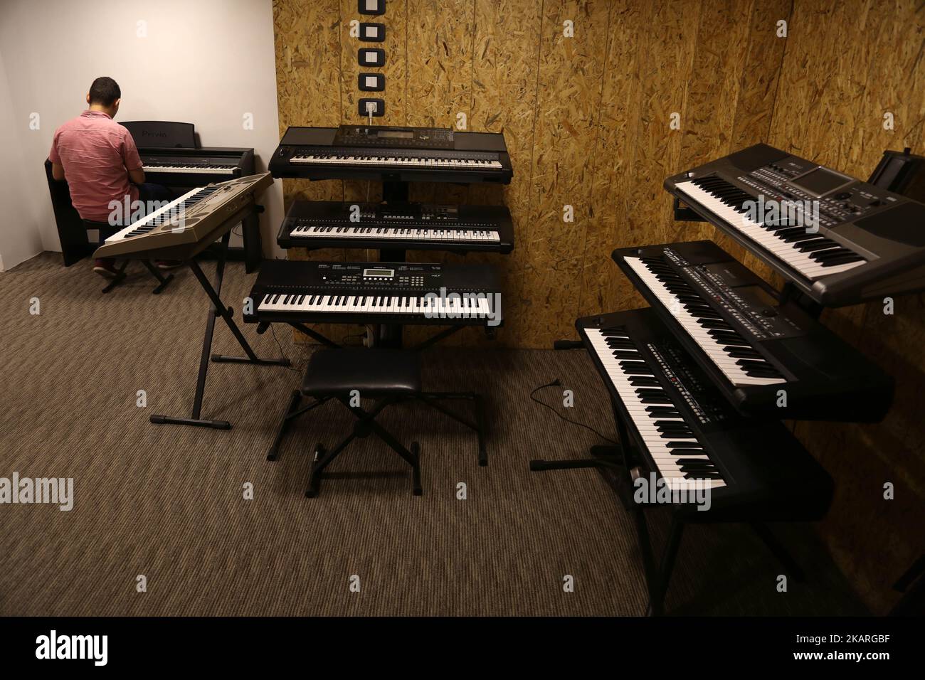 A Palestinian who works in the JARU Electronics Shop selling musical