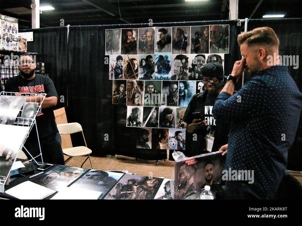 Artist Chris Holmes of Inner Demon Artwork has fun with his customers at the Walker Stalker Con at the Philadelphia Expo Center in Philadelphia on September 30, 2017. (Photo by Cory Clark/NurPhoto) Stock Photo