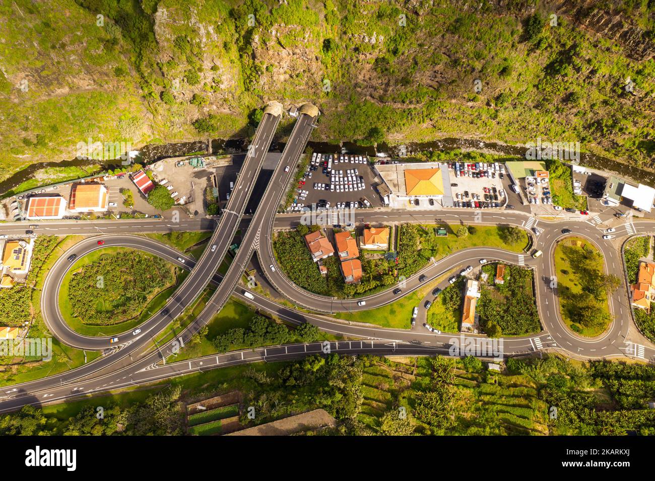 Drone photography of mountain highway going into mountain during summer