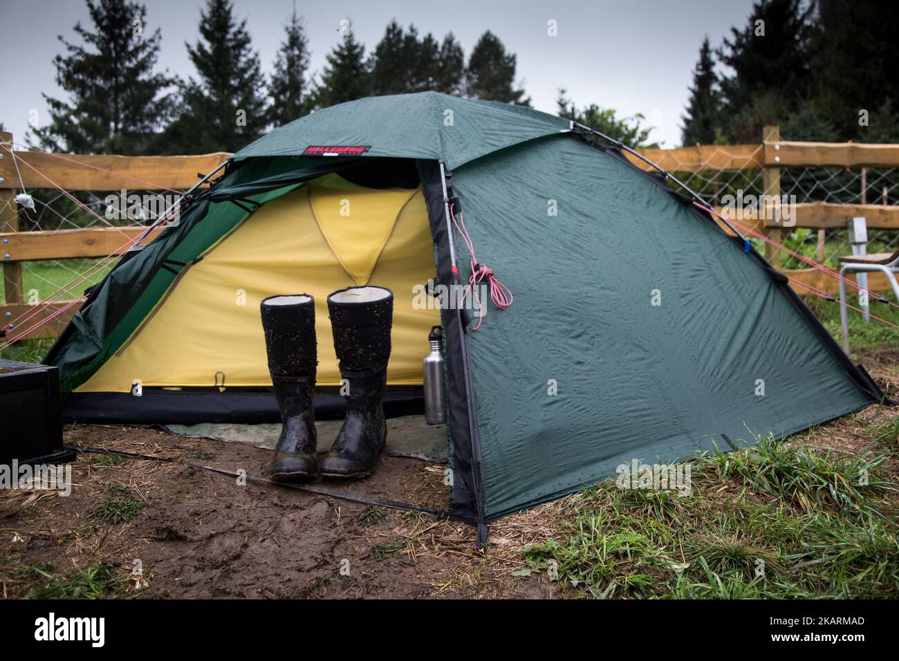 Pair of wellys near tent. 'Camp for Forest' Pogorzelce near Bialowieza on September 21, 2017. (Photo by Maciej Luczniewski/NurPhoto) Stock Photo