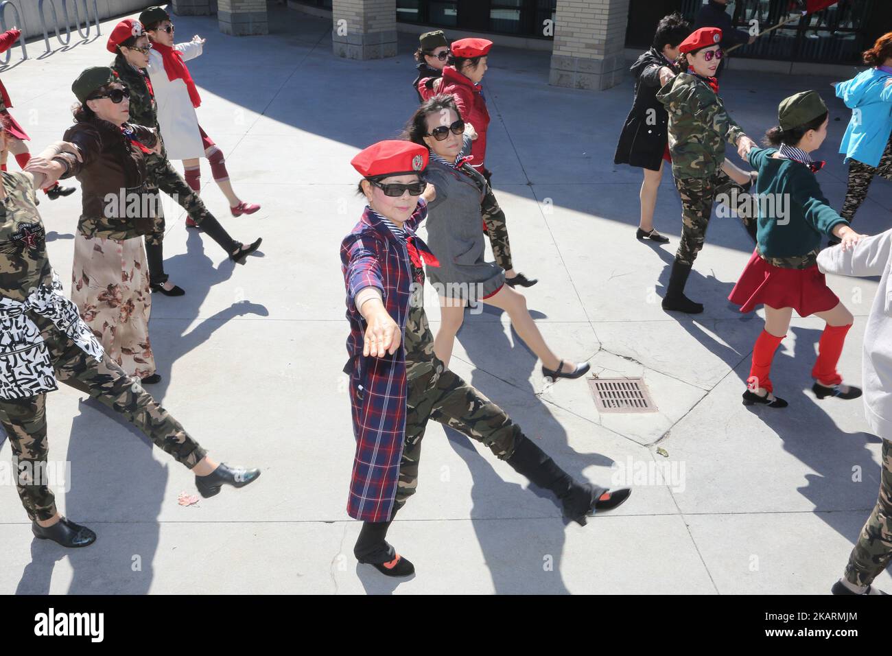 Chinese dancers dressed in military fatigues practice before a performance during Crime Prevention and Awareness Day in Mississauga, Ontario, Canada. These dancers performed a pro-China nationalist military themed dance and were part of a lineup of over 200 dancers that took part in this multi-cultural celebration. (Photo by Creative Touch Imaging Ltd./NurPhoto) Stock Photo