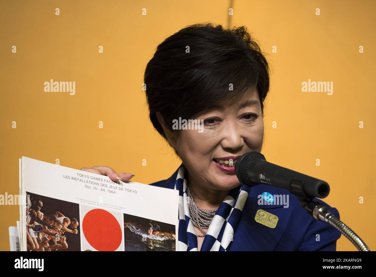 Tokyo Governor Yuriko Koike Shows A Book About The 1964 Tokyo Olympics tokyo-governor-yuriko-koike-shows-a-book-about-the-1964-tokyo-olympics