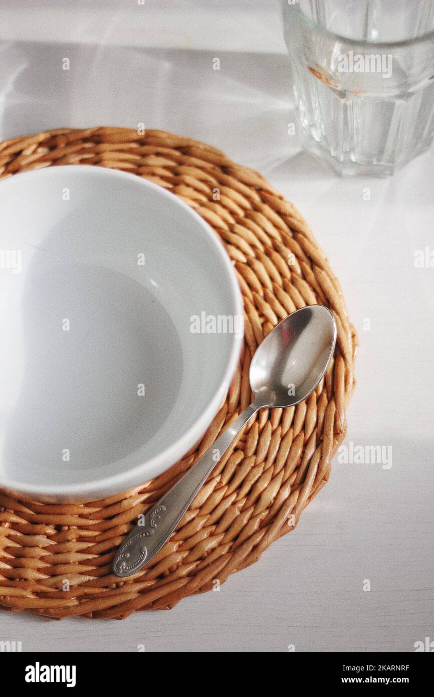 Empty white bowl and spoon Stock Photo
