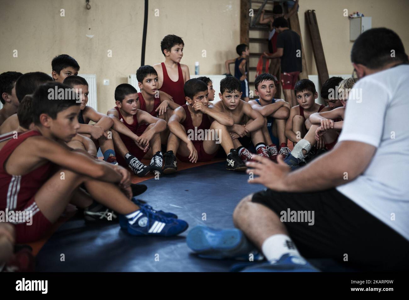 Georgian young wrestlers are coached by a local wrestling trainer at ...