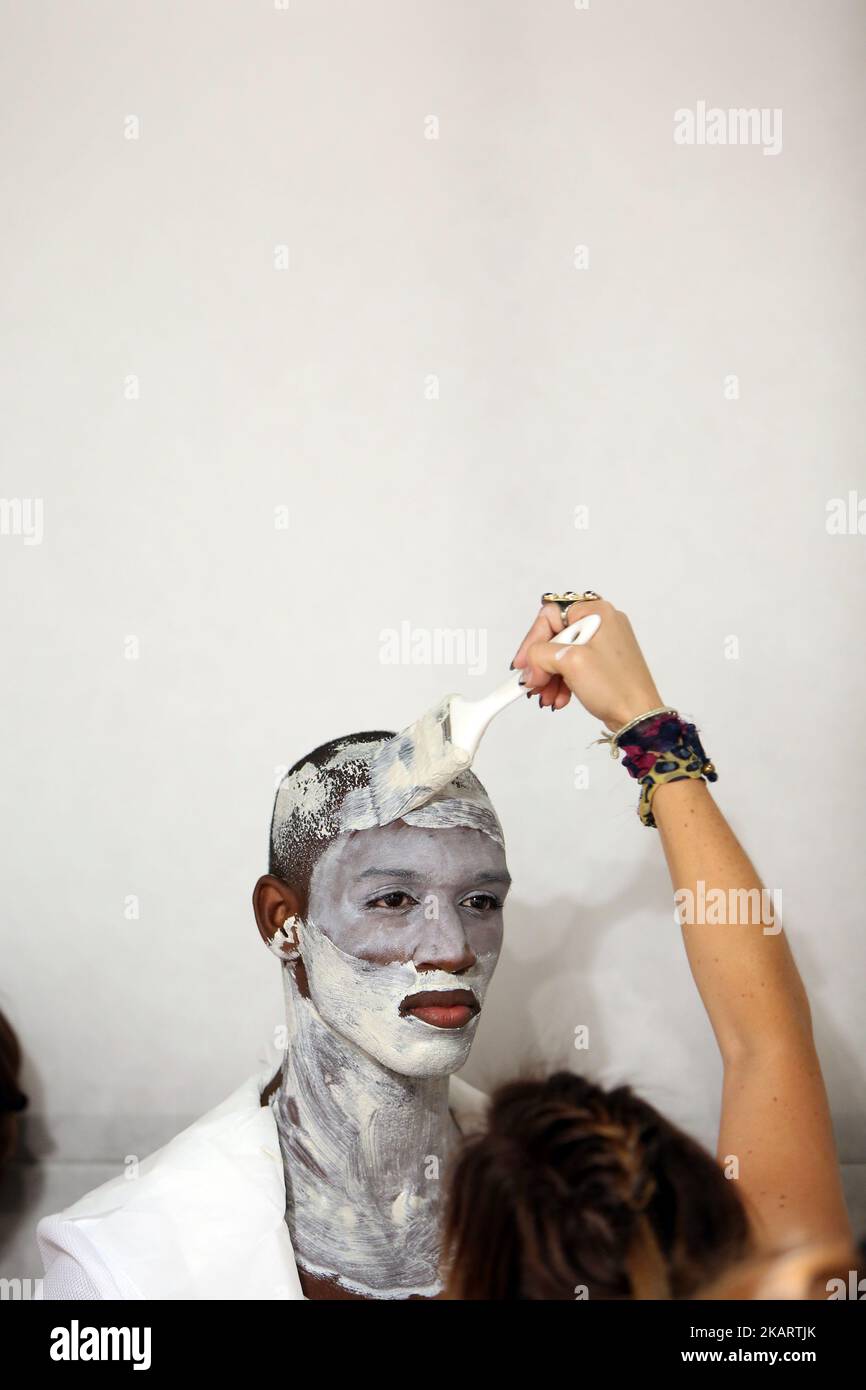 A model prepares backstage before the show as part of the Lisbon Fashion Week - Moda Lisboa at the Pavilhao Carlos Lopes in Lisbon, Portugal, on October 7, 2017. ( Photo by Pedro Fiúza/NurPhoto) Stock Photo