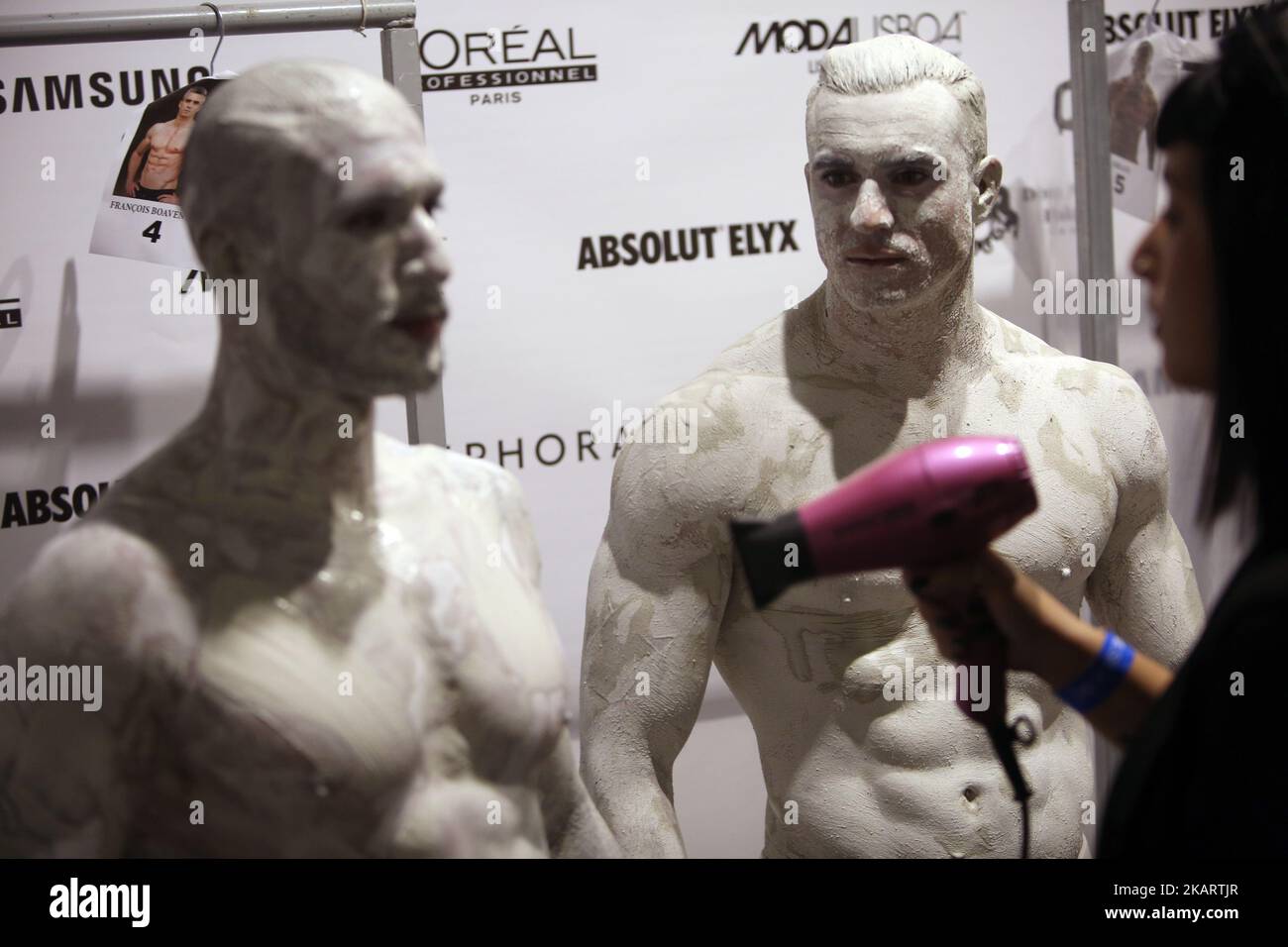 Models prepare backstage before the show as part of the Lisbon Fashion Week - Moda Lisboa at the Pavilhao Carlos Lopes in Lisbon, Portugal, on October 7, 2017. ( Photo by Pedro FiÃºza/NurPhoto) Stock Photo