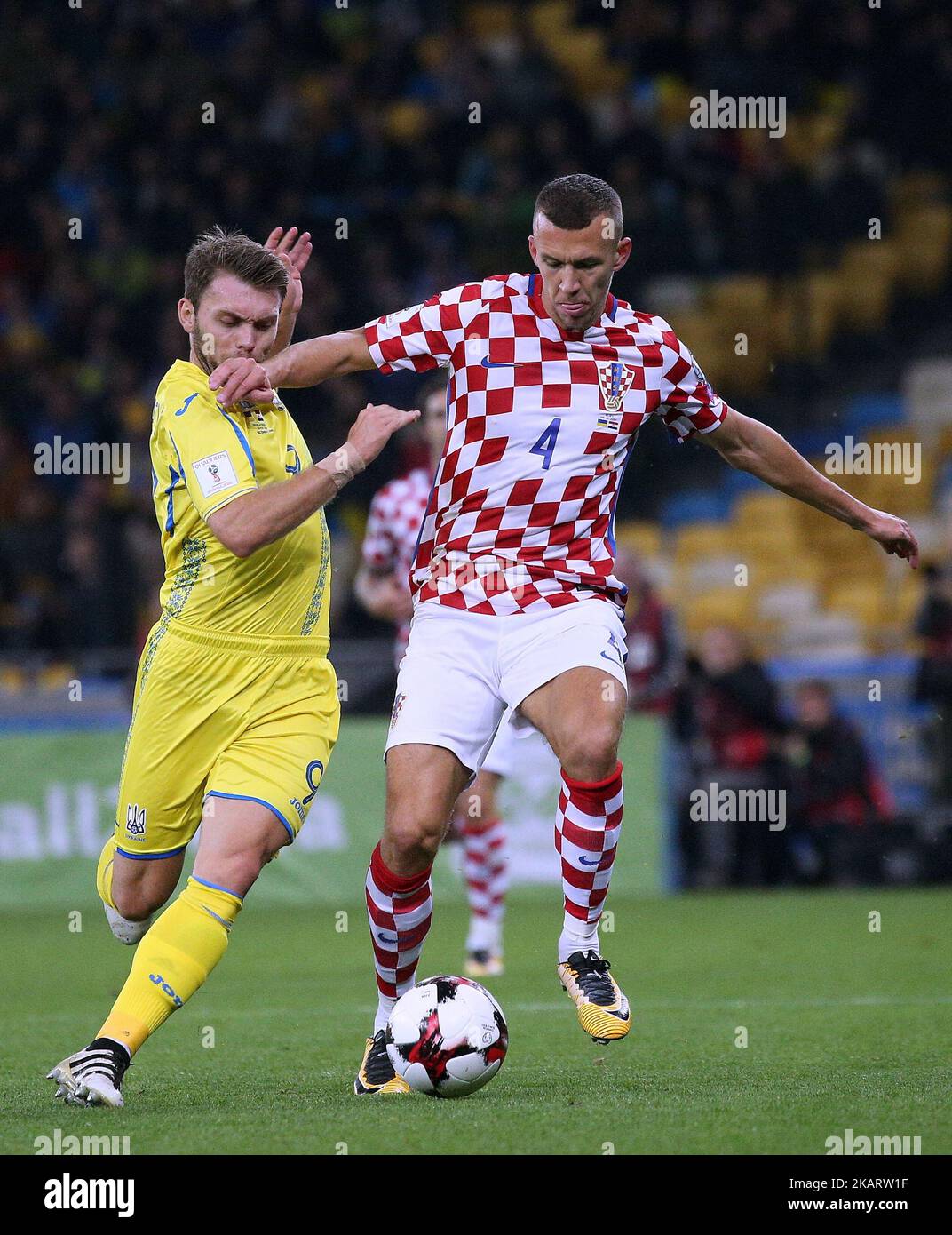 Ukraine's Olexandr Karavaev, left, and Croatiaâ€™s Ivan Perisic, right, in the fight for the ball during the World Cup Group I qualifying soccer match between Ukraine and Croatia at the Olympic Stadium in Kiev, Ukraine on October 9, 2017. (Photo by Danil Shamkin/NurPhoto) Stock Photo