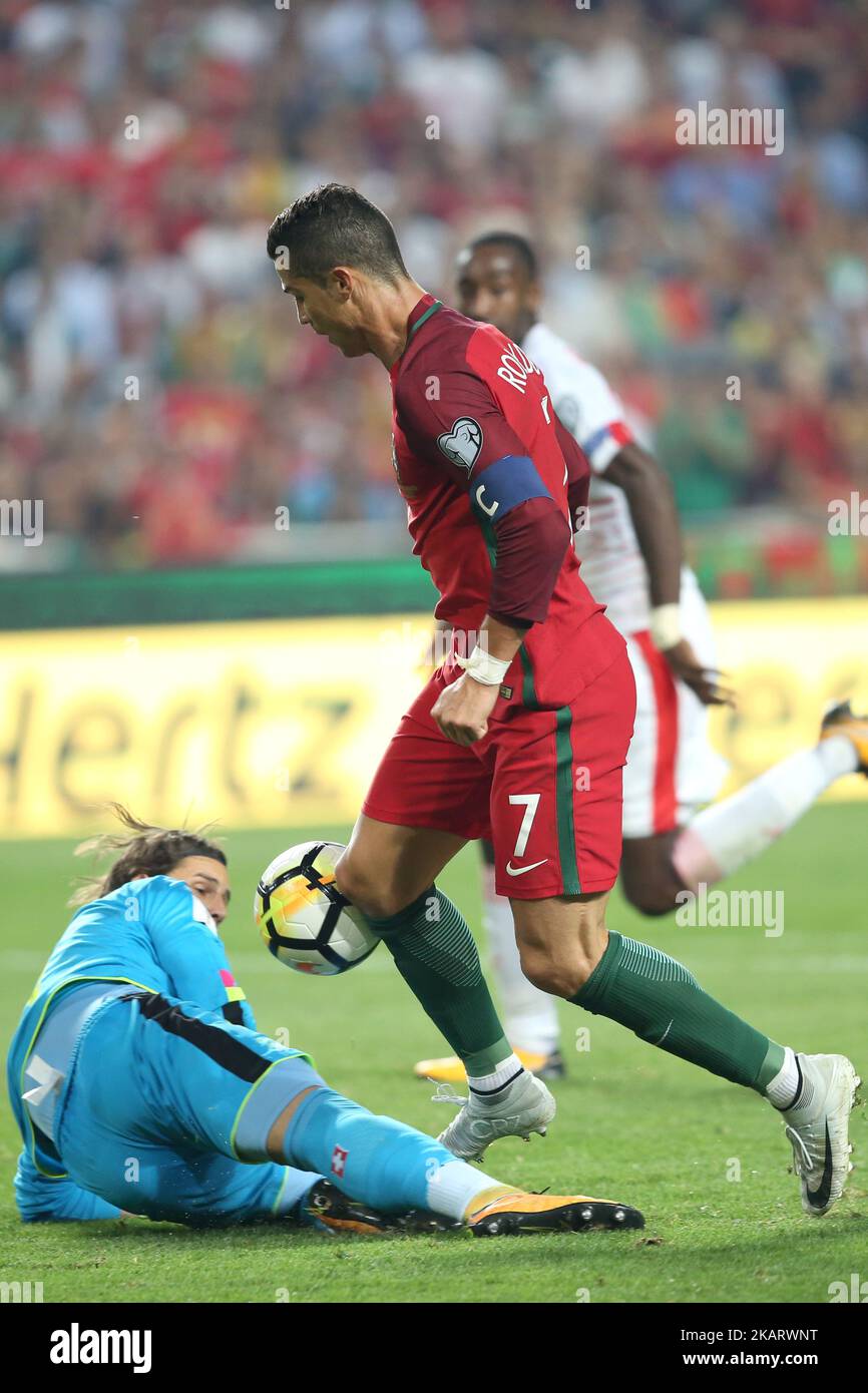 Portugal's forward Cristiano Ronaldo vies with Switzerland's goalkeeper Yann Sommer during the 2018 FIFA World Cup qualifying football match between Portugal and Switzerland at the Luz stadium in Lisbon, Portugal on October 10, 2017. ( Photo by Pedro FiÃºza/NurPhoto) Stock Photo
