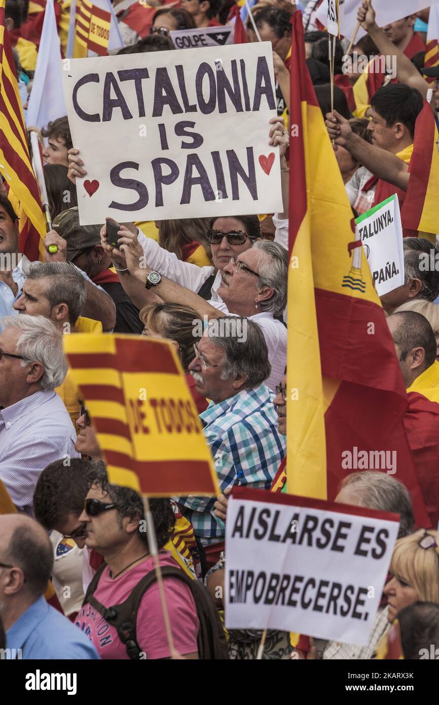 Thousands gather in Barcelona for a Spanish National Day Rally on October 12, 2017 in Barcelona, Spain. Spain marked its National Day with a show of unity by opponents of Catalonian independence, a day after the central government gave the region's separatist leader Carles Puigdemont until next week to clarify whether he intends to push ahead with separation. (Photo by Celestino Arce/NurPhoto) Stock Photo