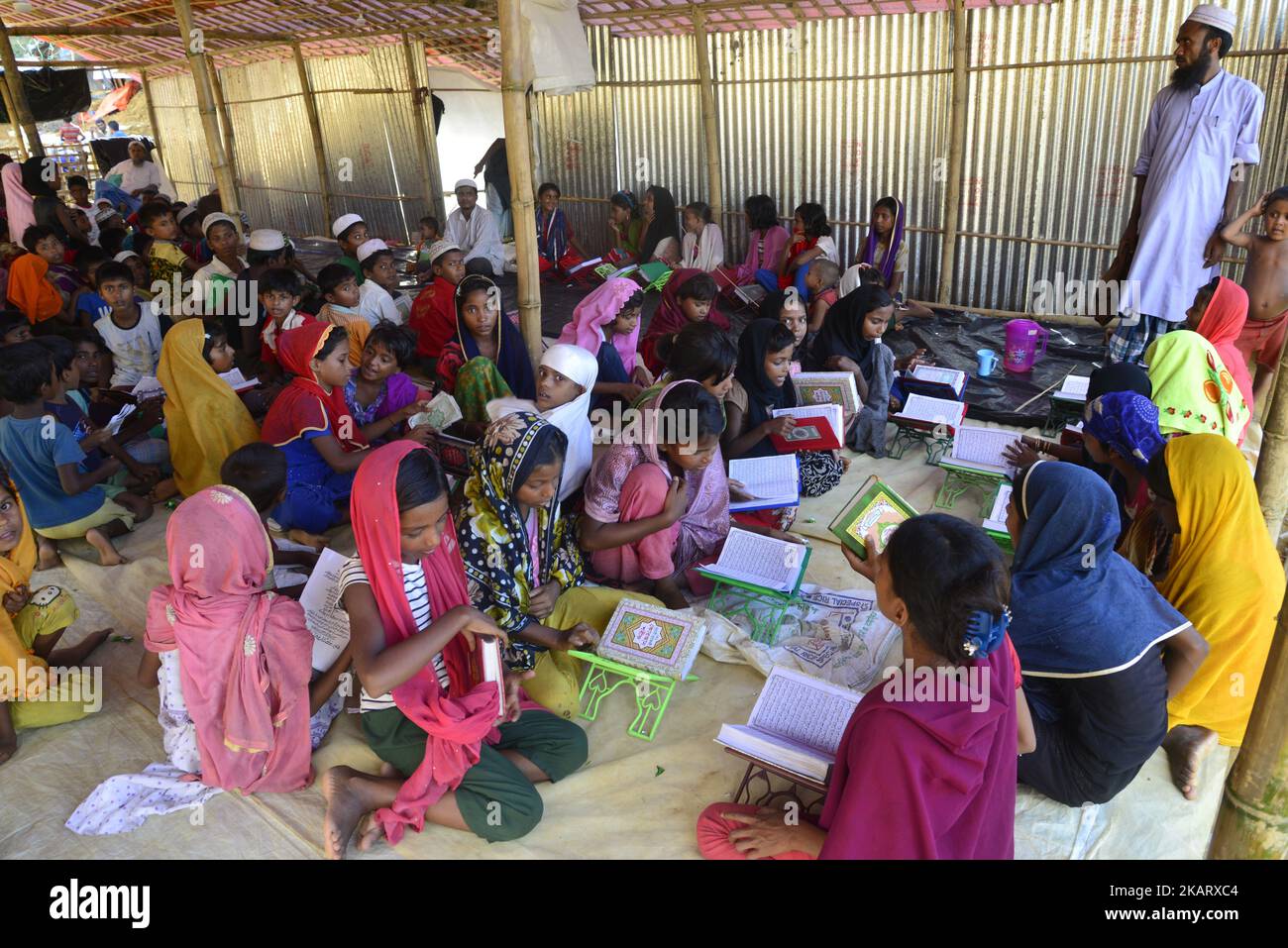 Rohingya children are learning the Qur'an in a Madrasa at the Balukhali ...