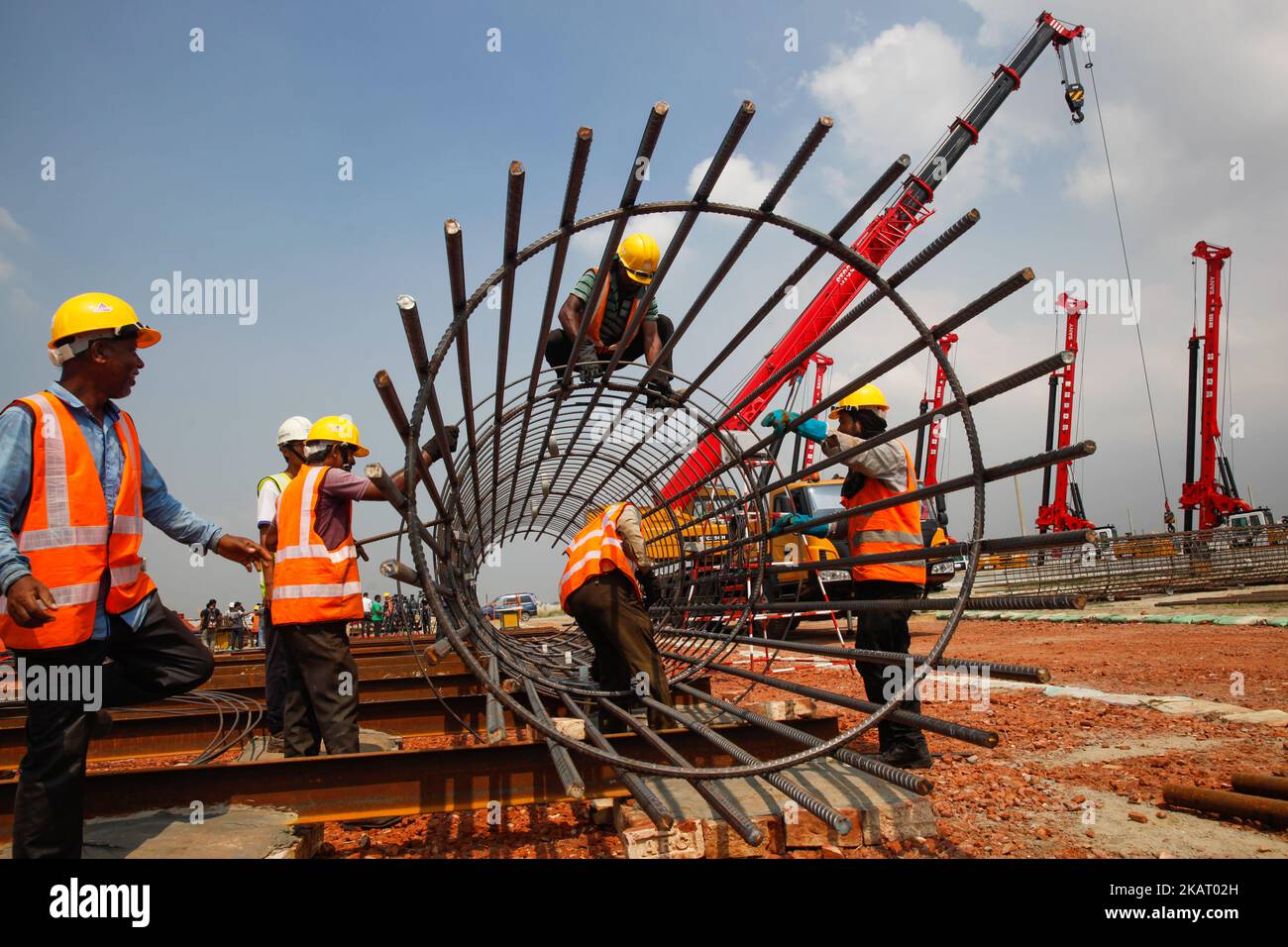 Bangladeshi construction workers working at the construction site of