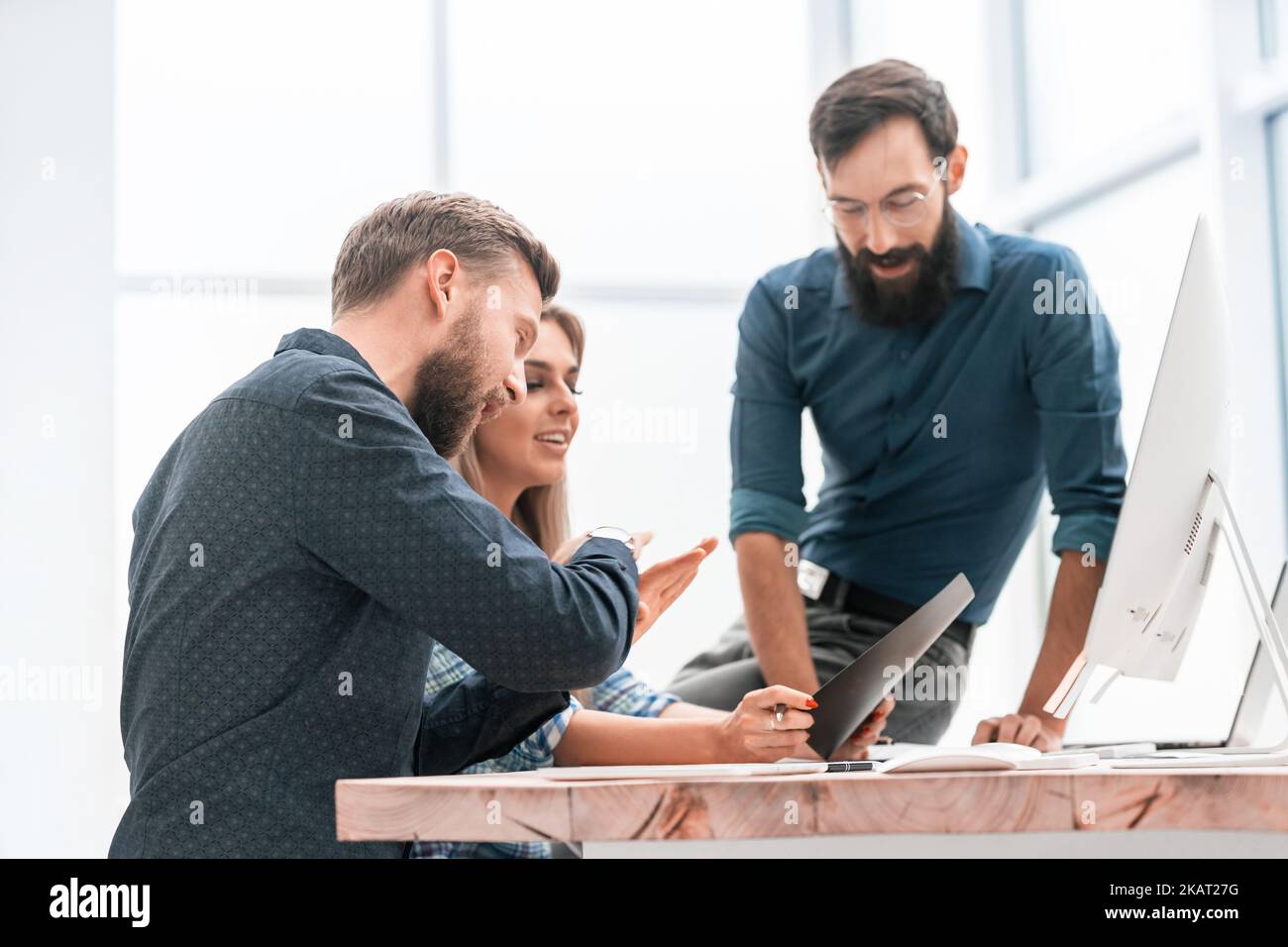 colleagues extending their hands to each other for a handshake Stock Photo