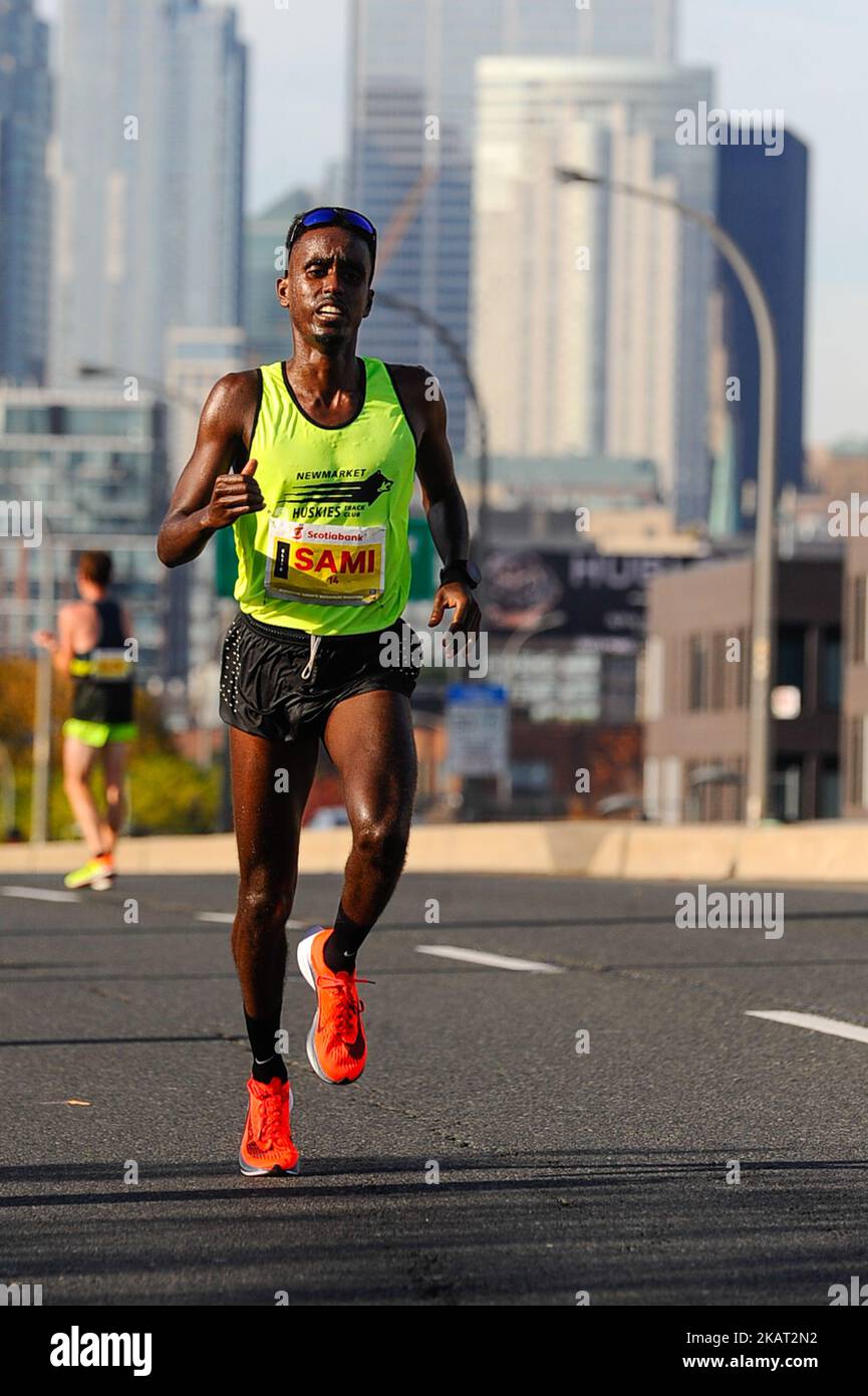 Canadian Runner Sami Jibril competes Scotiabank Toronto Waterfront Marathon races on October 22, 2017 in Toronto, Canada. More than 25,000 people ran in three Scotiabank Toronto Waterfront Marathon. Kenyan runner Philemon Rono ran a historic Scotiabank Toronto Waterfront Marathon crossing the finish line at 2:06:51 — winning the race and setting a new record for the fastest marathon run on Canadian soil. (Photo by Anatoliy Cherkasov/NurPhoto) Stock Photo