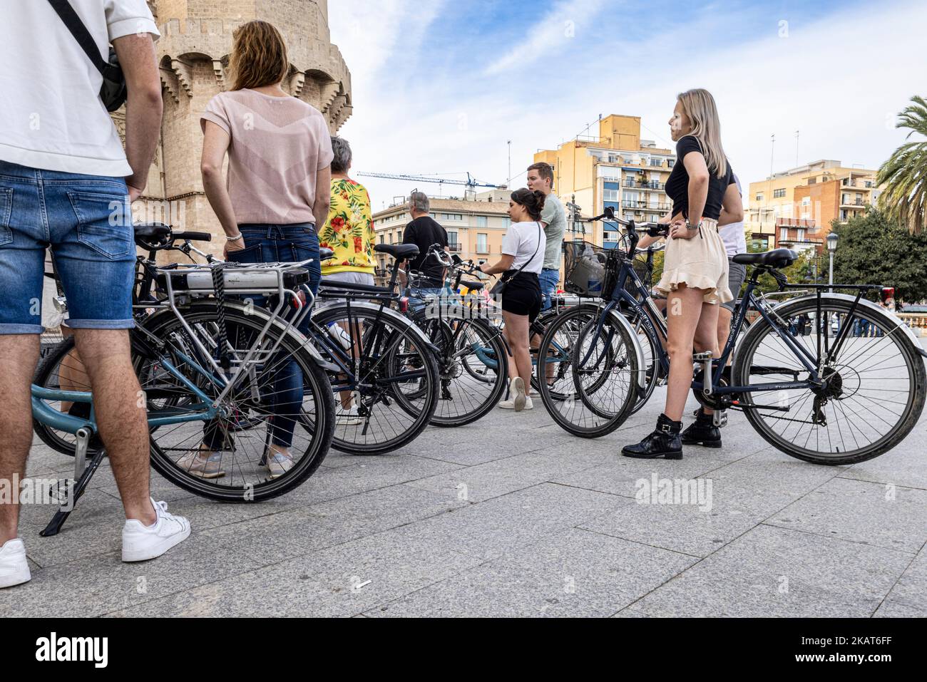 Bicycle tour group of visitors at Torres de Serranos, Porta de Serrans, Valencia, Spain Stock Photo