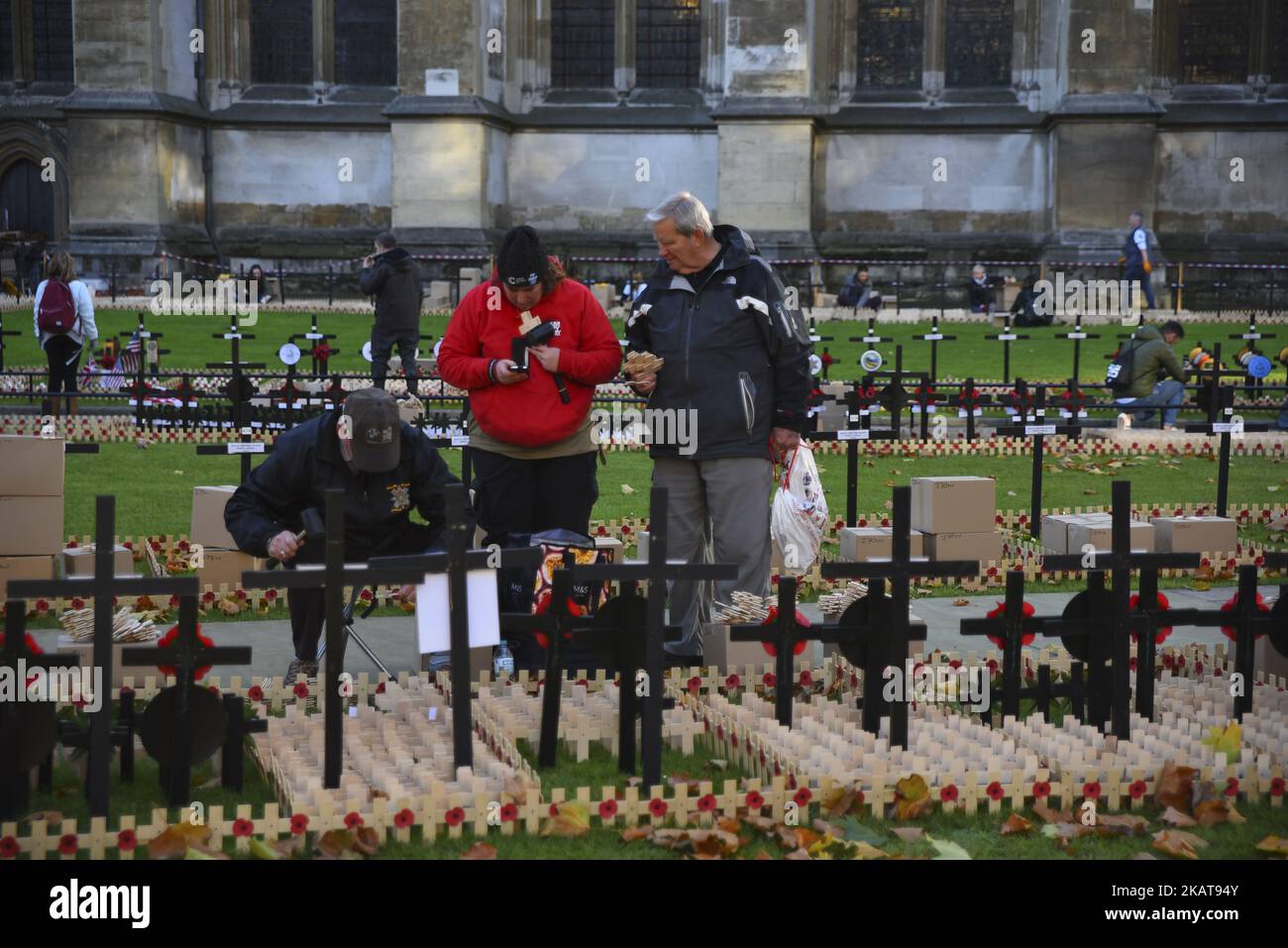 High Roding War Memorial Crosses of Remembrance, bearing the names of fallen soldiers, are being ...