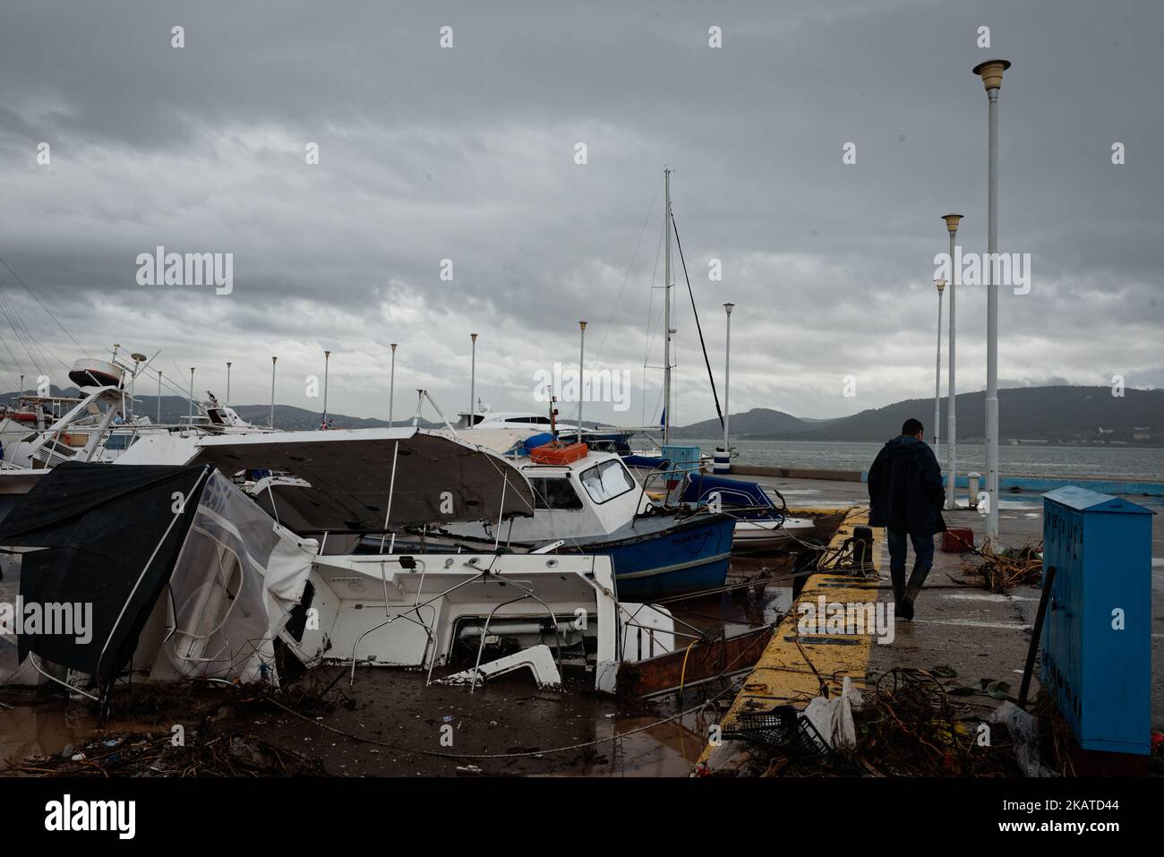 Damages caused by floods are seen at the harbour of Nea Peramos, Greece on November 17, 2017. Flash floods have killed 16 people causing 'biblical damage' as fast-flowing torrents of red mud flooded roads in the western outskirts of the Greek capital, Athens. (Photo by Gerasimos Koilakos/NurPhoto) Stock Photo