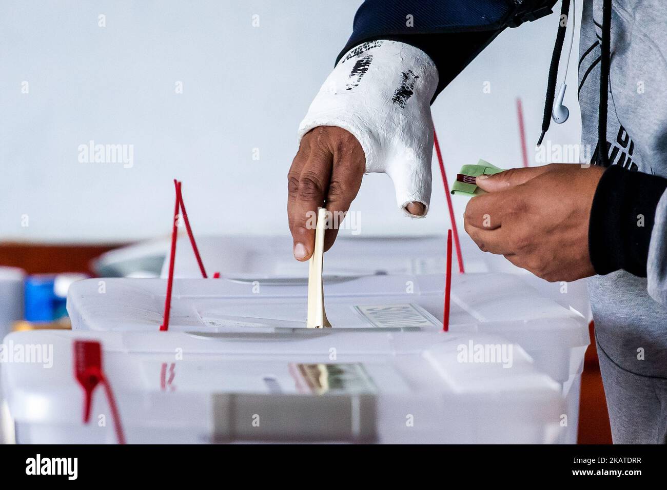 A voter casts a ballot at a polling station during the presidential