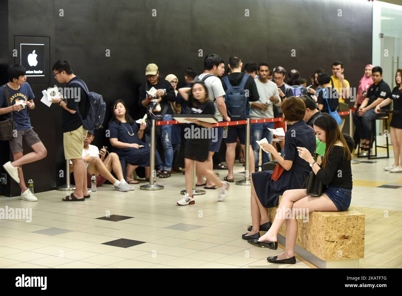 People line up outside at Mac City Apple Reseller Store to buy the new iPhone X after the release of the new phone in Kuala Lumpur on November 24, 2017 in Malaysia. (Photo by Chris Jung/NurPhoto) Stock Photo