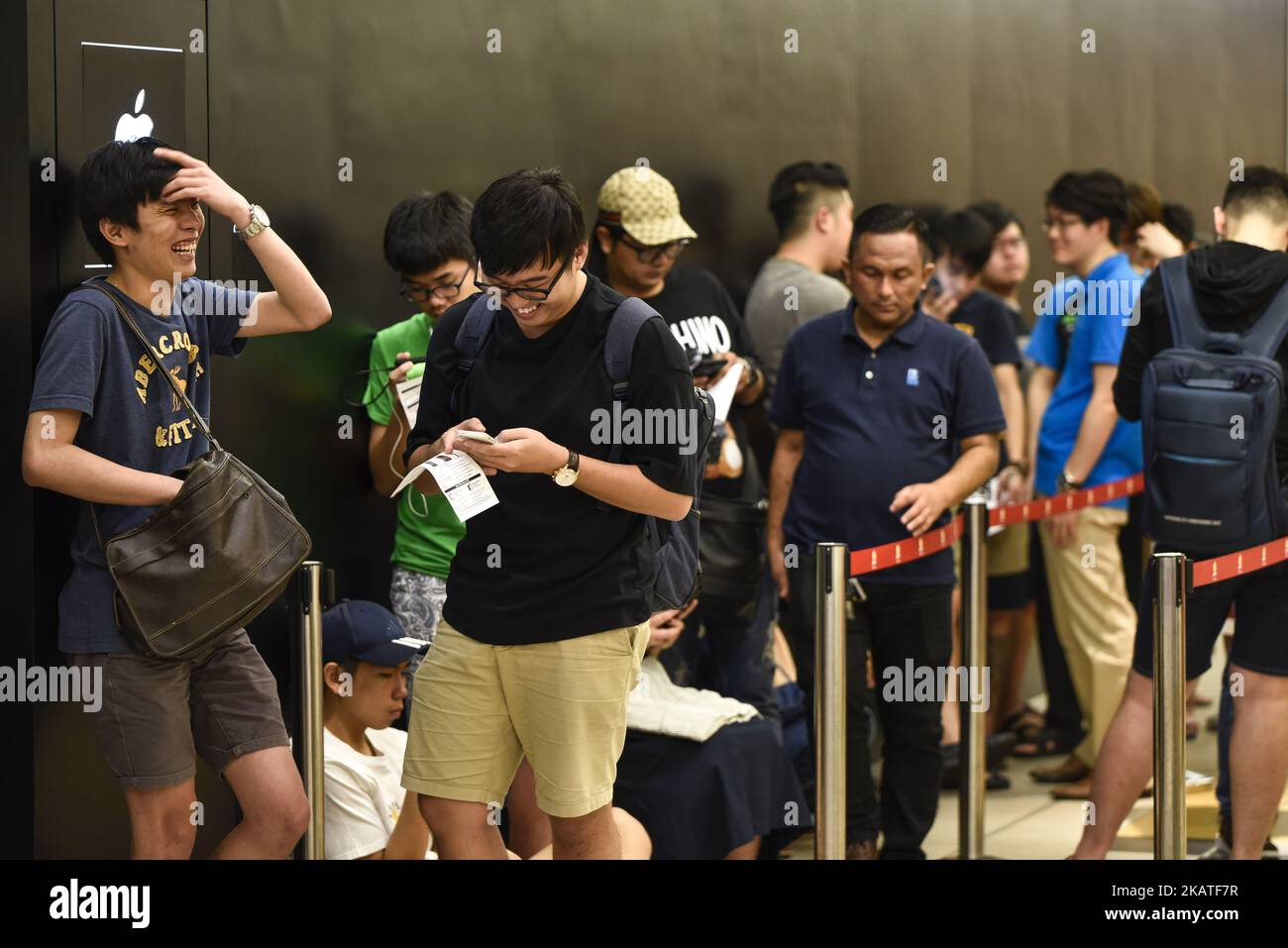 People line up outside at Mac City Apple Reseller Store to buy the new iPhone X after the release of the new phone in Kuala Lumpur on November 24, 2017 in Malaysia. (Photo by Chris Jung/NurPhoto) Stock Photo