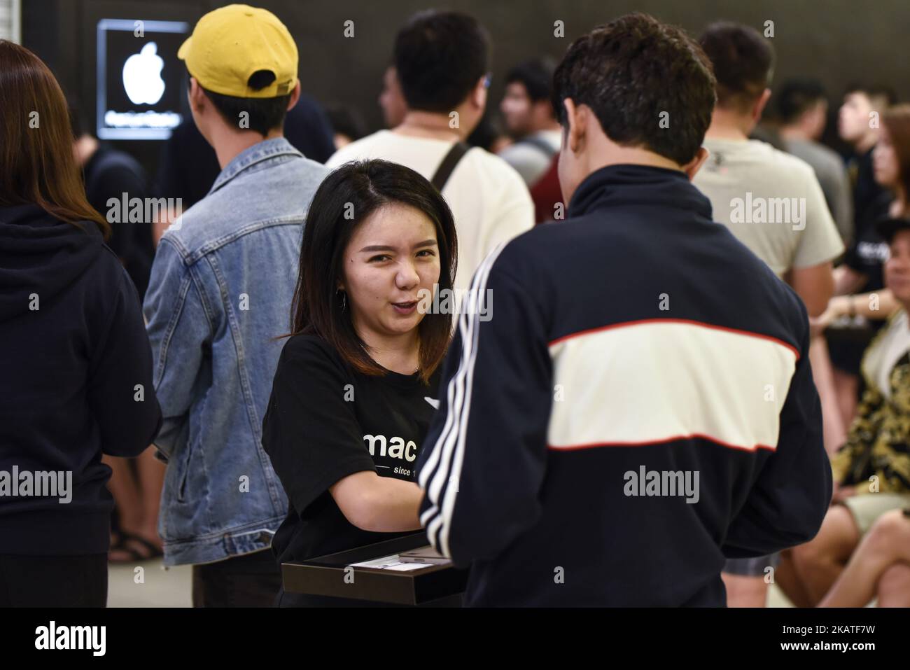 People line up outside at Mac City Apple Reseller Store to buy the new iPhone X after the release of the new phone in Kuala Lumpur on November 24, 2017 in Malaysia. (Photo by Chris Jung/NurPhoto) Stock Photo