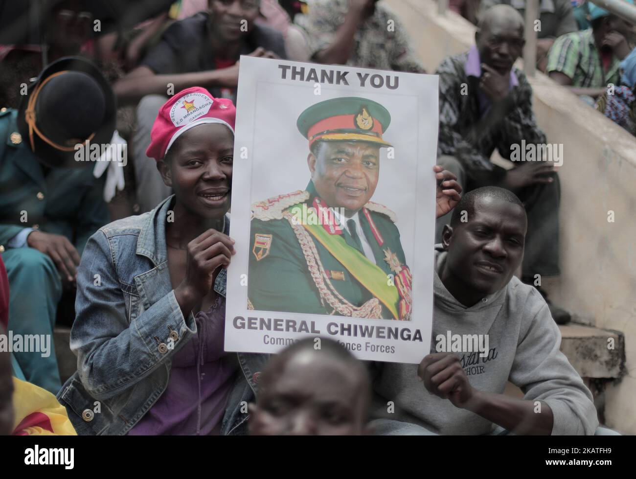 People react as Zimbabwean new President Emmerson Mnangagwa is officially sworn-in during a ceremony in Harare on November 24, 2017. Emmerson Mnangagwa took the oath of office on November 24th at the national sports stadium on the outskirts of Harare to cheers from the full-to-capacity crowd.(Photo by Belal Khaled/NurPhoto) Stock Photo