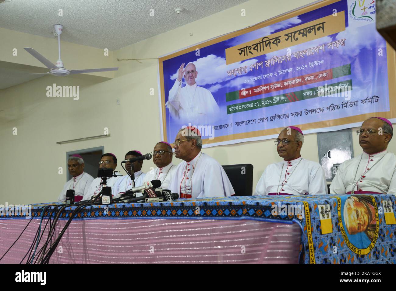 Pope Francis will visit Dhaka from November 30 to December 2, which comes after his visit to Myanmar, Cardinal Patrick D' Rozario (C) says at a press conference at Ramna Cathedral on Monday, November 27, 2017.'They are praying and preparing to join a mass [prayer service] at the Suhrawardy Udyan on December 1,' Cardinal Patrick D' Rozario said.Around 80,000 Christians are expected to attend the service, Cardinal added. On November 30, Pope would visit the National Martyrs' Monument in Savar, Bangabandhu Memorial Museum in Dhanmondi, meet the president, officials, diplomats and civil society me Stock Photo