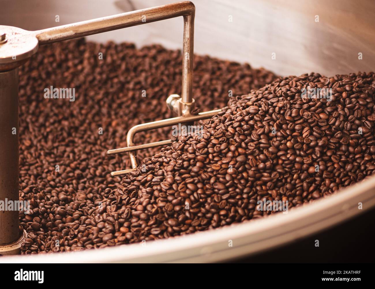 Roasting coffee beans in a professional old coffee roasting machine or