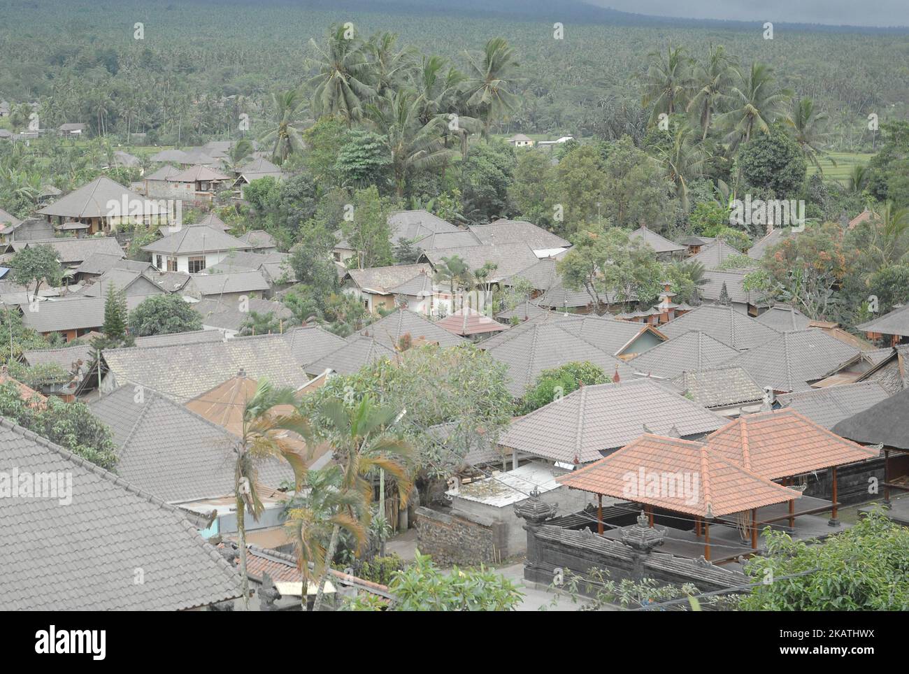 Volcanic ash of Mount Agung eruption looks enveloped the house of citizens in the area Bebandem, Karangasem, Bali, on November 30,2017. Bebandem area is the worst hit by eruption ash eruption of Mount Agung with a distance of 8 kilometers or around the red zone so that the village is deserted at leave the occupants of the house to the safe zone. considering that in 1963 Mount Agung erupted and killed 280 people who did not want to evacuate. (Photo by Dasril Roszandi/NurPhoto) Stock Photo