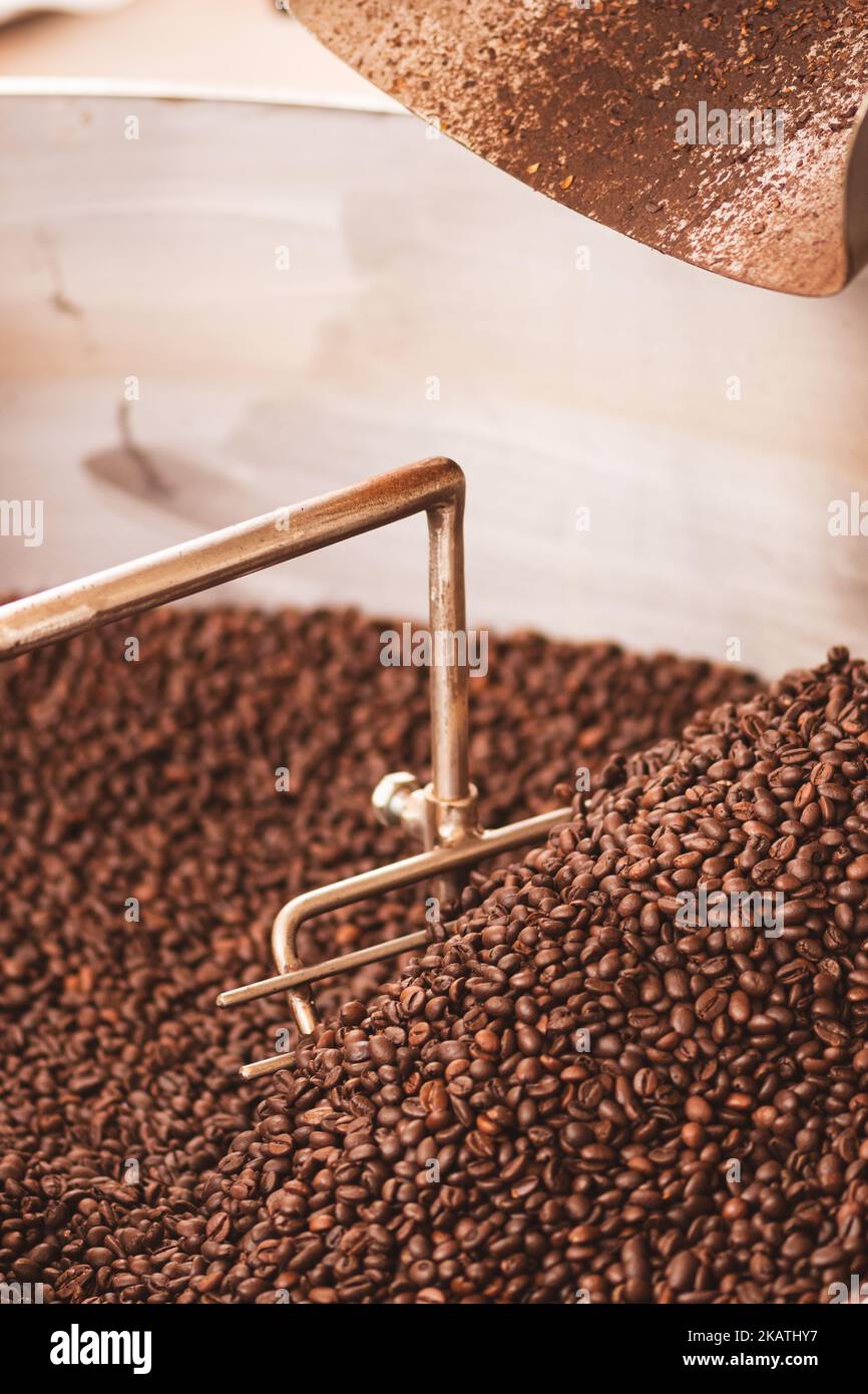Roasting coffee beans in a professional old coffee roasting machine or