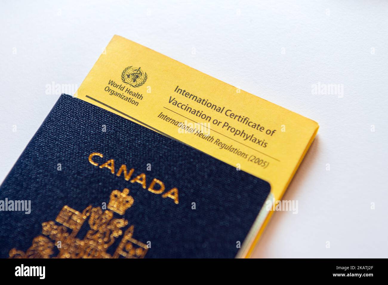 A Canadian passport with a world health organisation vaccine passport