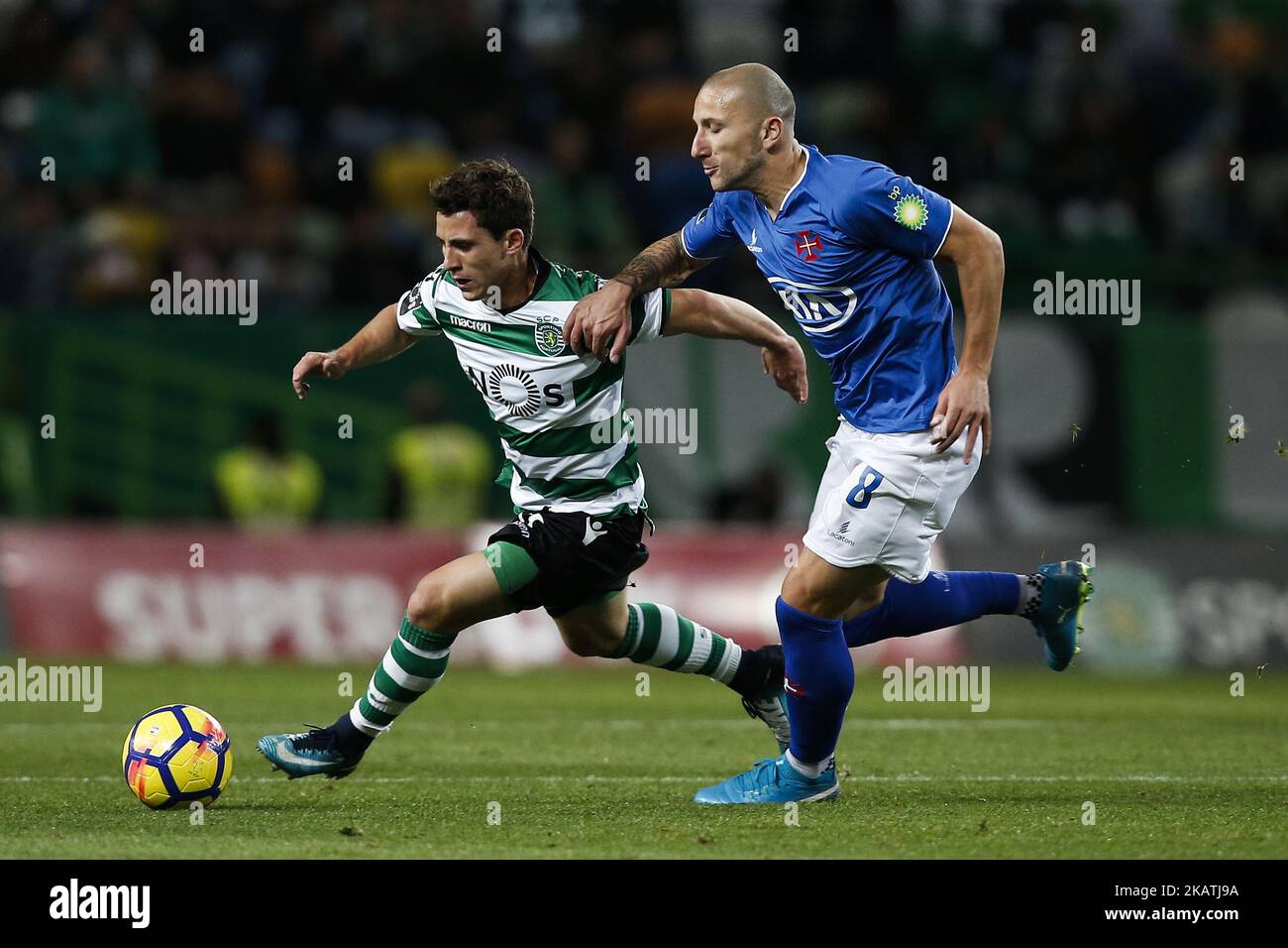 Sporting's forward Daniel Podence (L) vies for the ball with Belenenses's midfielder Andre Sousa (R) during Primeira Liga 2017/18 match between Sporting CP vs CF Belenenses, in Lisbon, on December 1, 2017. (Photo by Carlos Palma/NurPhoto) Stock Photo