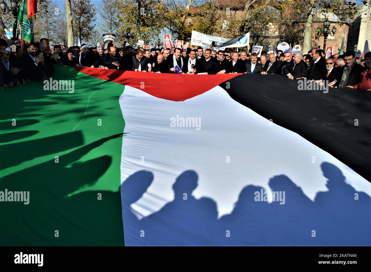 A photo taken in Ankara, Turkey on December 8, 2017 shows protesters hold a giant Palestinian flag as Turkish Muslims take part in a protest outside the Haci Bayram Mosque after a traditional Friday prayer against U.S. President Donald Trump's official recognition the city of Jerusalem as the capital of Israel on December 6. (Photo by Altan Gocher/NurPhoto) Stock Photo