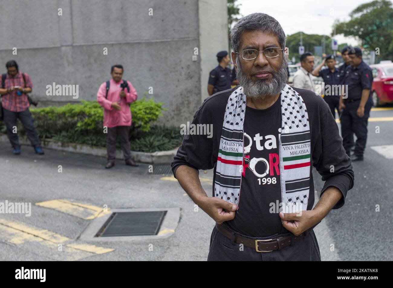 Muslim protesters march to the U.S. Embassy during a protest in Kuala Lumpur, Malaysia on December 08, 2017. Malaysian Muslims were protesting outside the U.S. Embassy over Washington's controversial move to recognize Jerusalem as Israel's capital. (Photo by Chris Jung/NurPhoto) Stock Photo