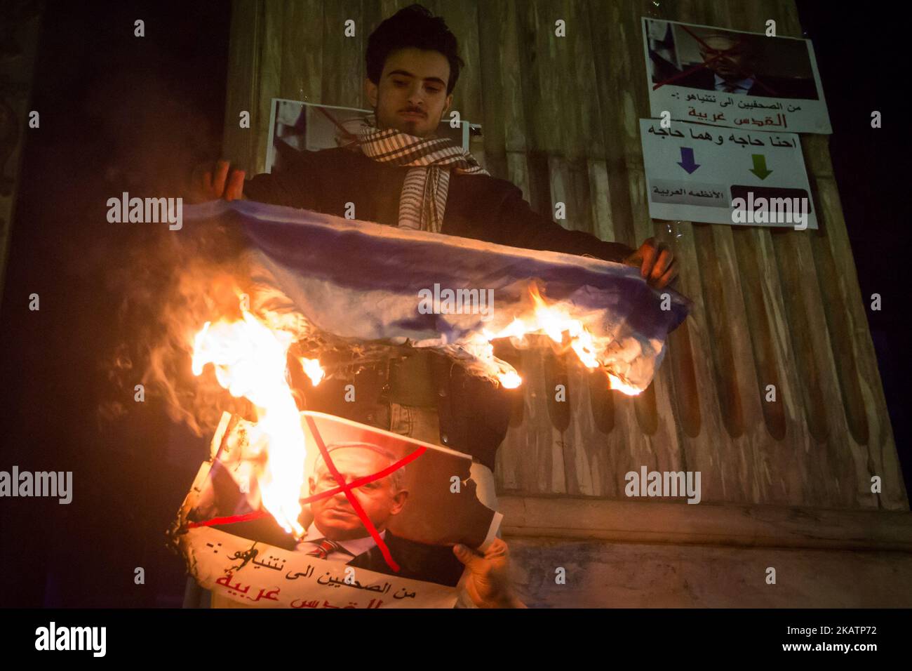 Egyptian protesters burn an Israeli flag and portrait of Israeli Prime ...