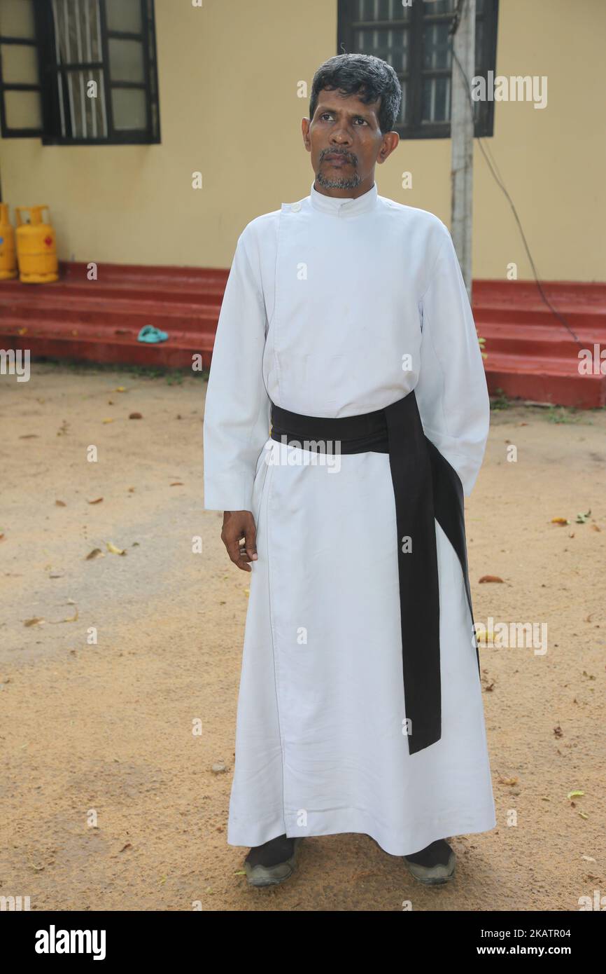 Father Daniel outside the Karuna Nilayam Church of Ceylon in Killinochchi, Sri Lanka. (Photo by Creative Touch Imaging Ltd./NurPhoto) Stock Photo