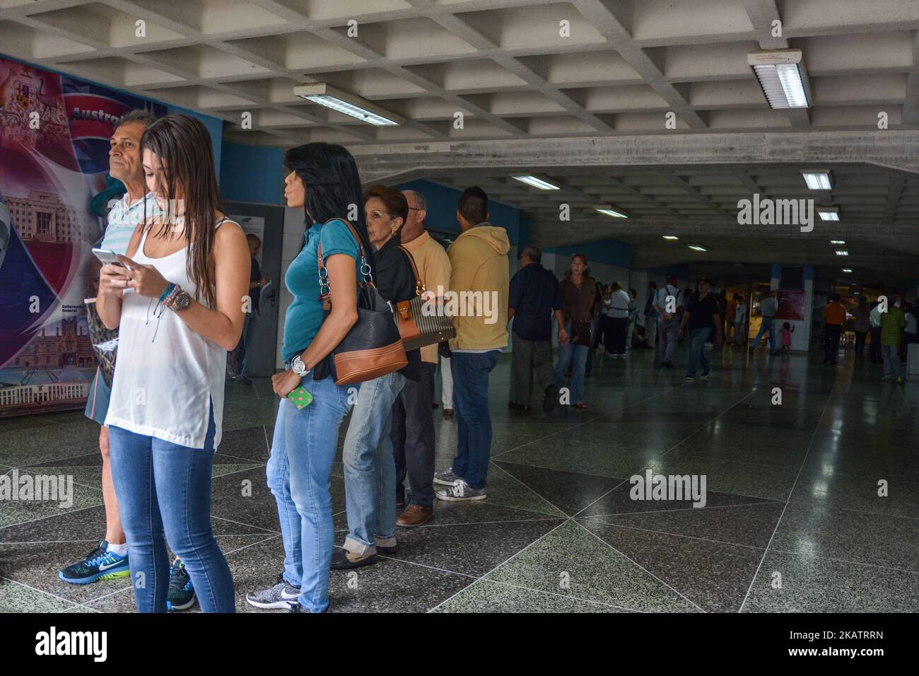 Venezuelans wait at a polling station to cast their vote during municipal elections in Caracas on December 10, 2017. (Photo by Roman Camacho/NurPhoto) Stock Photo