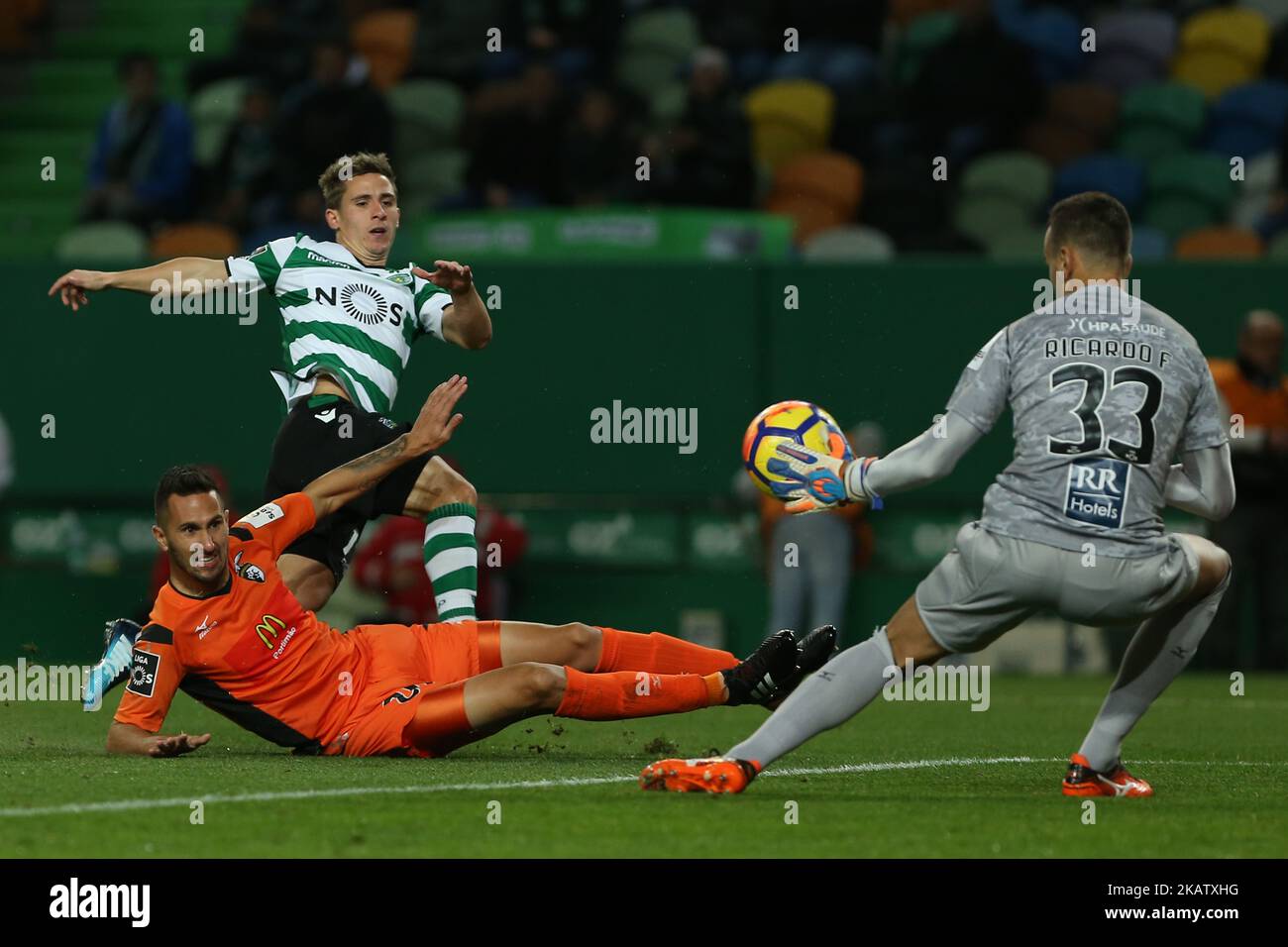 Sportings forward Daniel Podence from Portugal (L) and Portimonense's goalkeeper Ricardo Ferreira (R) during Premier League 2017/18 match between Sporting CP and Portimonense SC, at Alvalade Stadium in Lisbon on December 17, 2017. (Photo by Bruno Barros / DPI / NurPhoto)  Stock Photo
