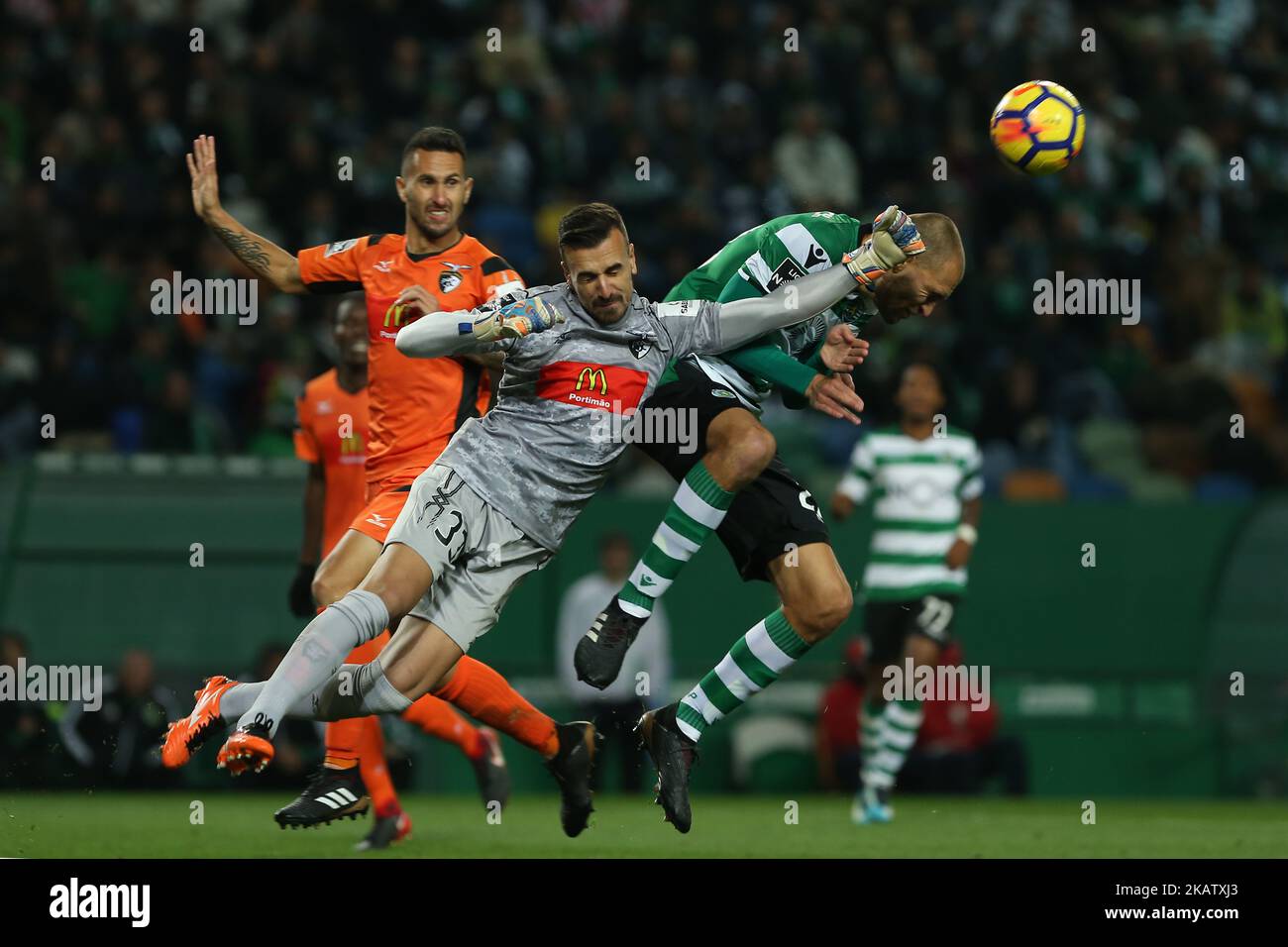 Portimonense's goalkeeper Ricardo Ferreira (L) and Sportings forward Bas Dost from Holland (R) during Premier League 2017/18 match between Sporting CP and Portimonense SC, at Alvalade Stadium in Lisbon on December 17, 2017. (Photo by Bruno Barros / DPI / NurPhoto)  Stock Photo