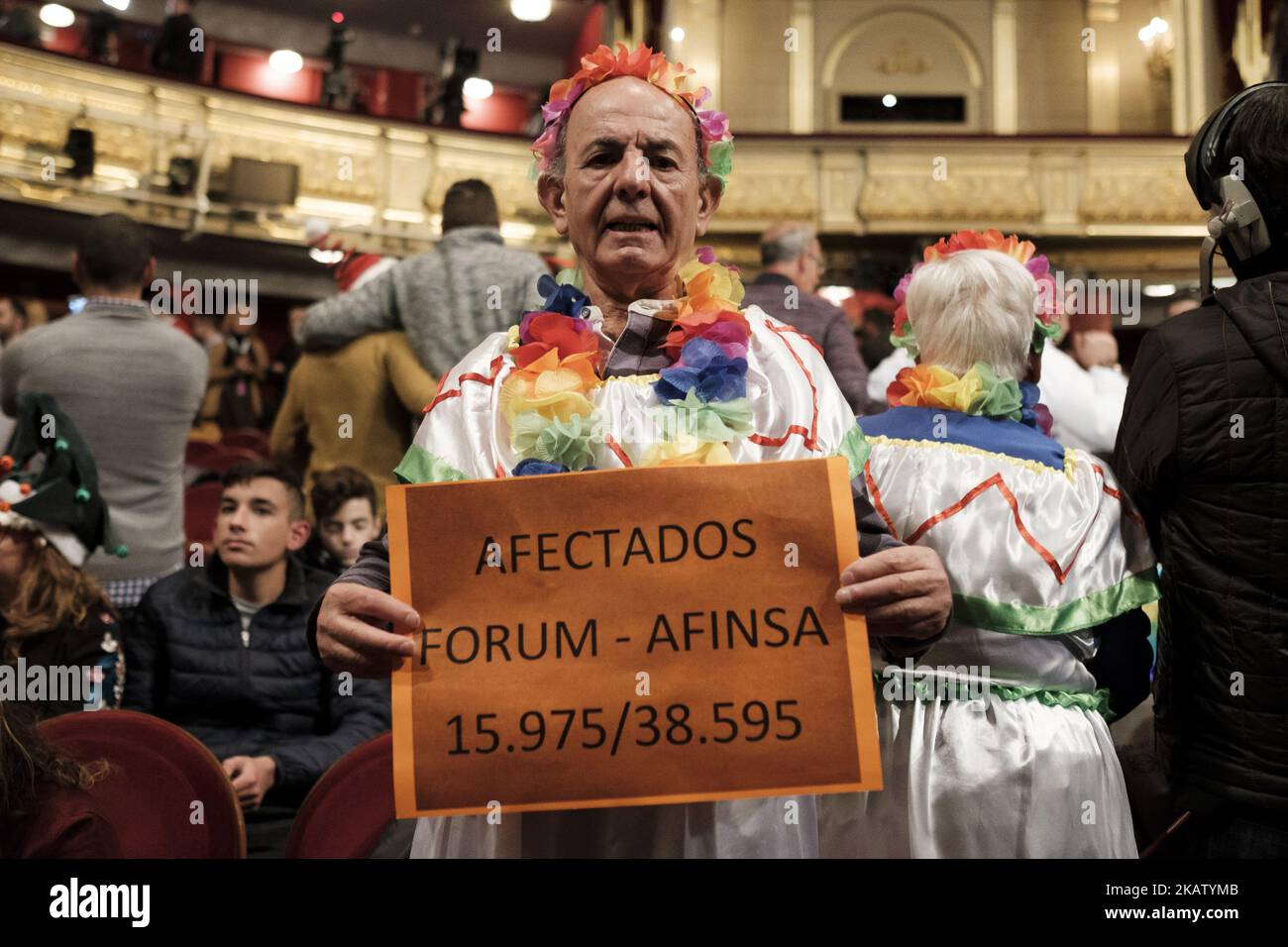 Spectators wearing fancy dress attend the draw of Spain's Christmas lottery named 'El Gordo' (Fat One) at the Teatro Real on December 22, 2017 in Madrid, Spain. The winning number wins a total of 4 million euros for the top prize to be shared between ten ticket holders (Photo by Oscar Gonzalez/NurPhoto) Stock Photo