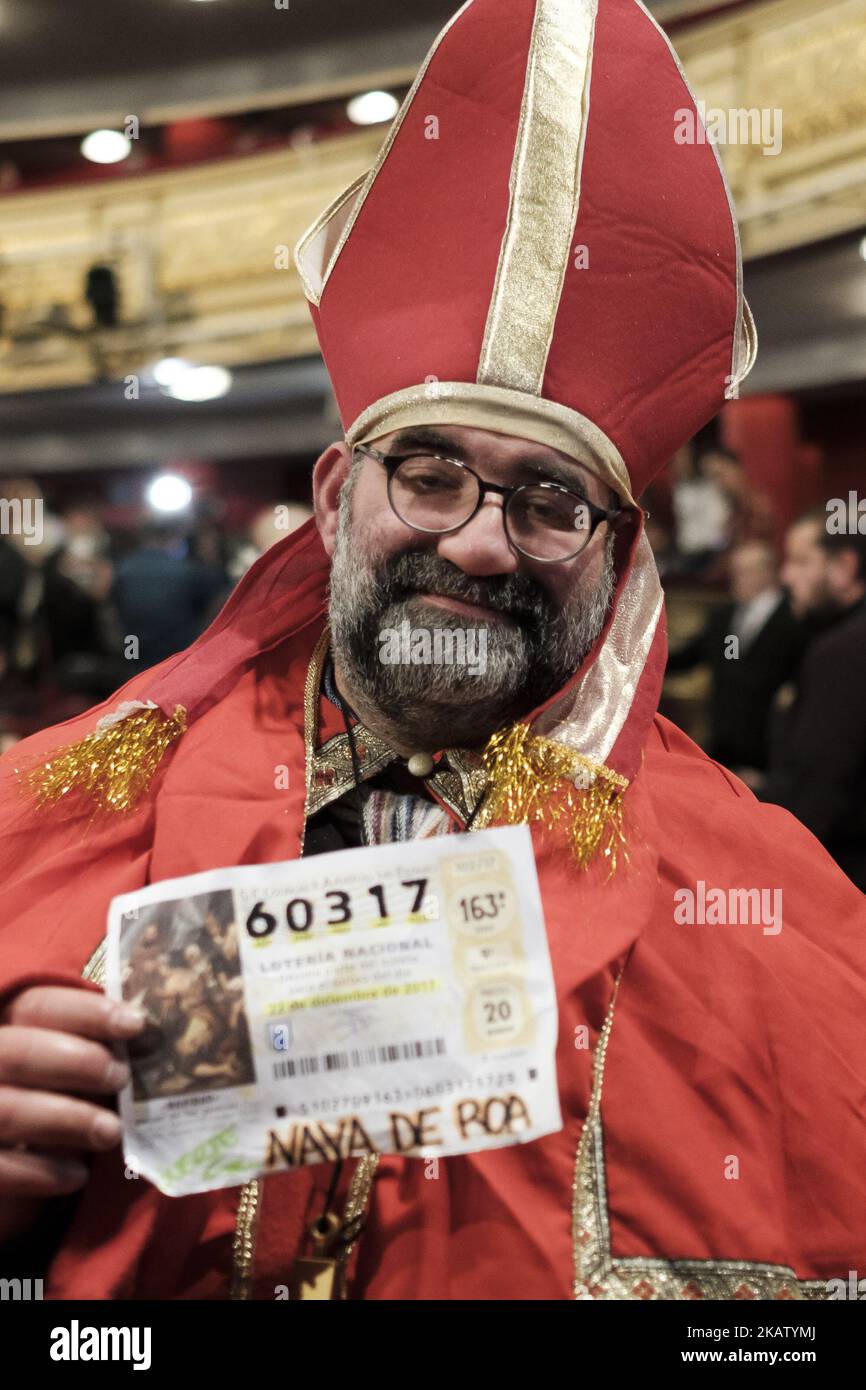 Spectators wearing fancy dress attend the draw of Spain's Christmas lottery named 'El Gordo' (Fat One) at the Teatro Real on December 22, 2017 in Madrid, Spain. The winning number wins a total of 4 million euros for the top prize to be shared between ten ticket holders (Photo by Oscar Gonzalez/NurPhoto) Stock Photo