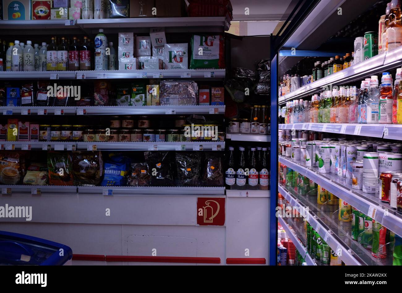 Corner of an European Asian supermarket, with colorful beverages and cooking products Stock Photo