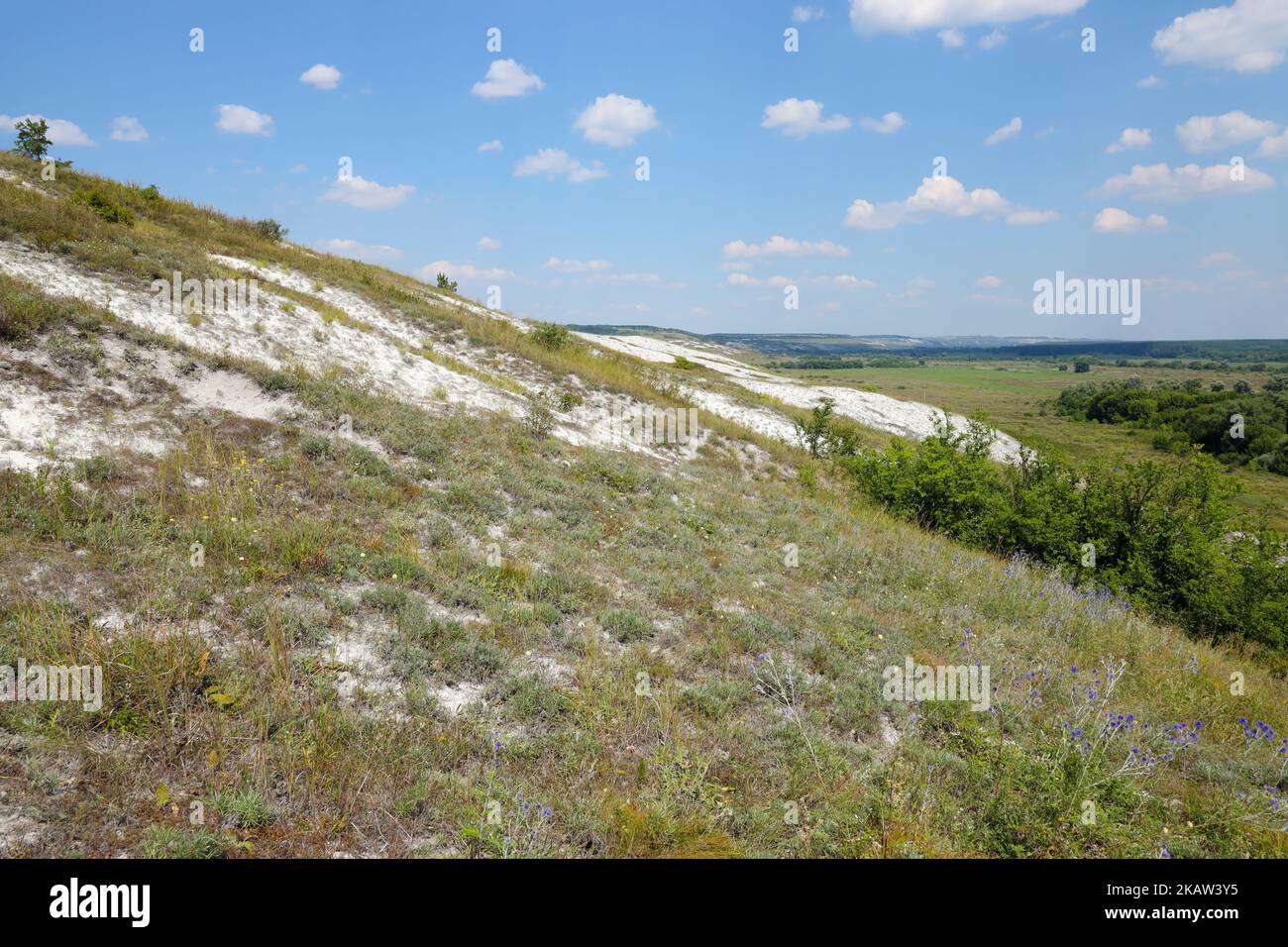 Ancient multimillion chalk mountains on the steppe surface of earth. White chalk mountains in the Dvurechansky park reserve in Ukraine Stock Photo