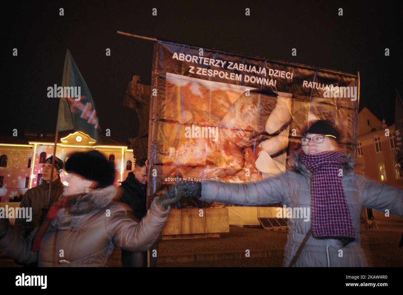 People are seen holding hands and dancing at the end of a rosary for the renewal of the moral of the Polish nation, an anti-abortion rally in Bydgoszcz, Poland on January 13, 2018. This week parliament voted for a proposal further restricting already very strict abortion laws. (Photo by Jaap Arriens/NurPhoto) Stock Photo