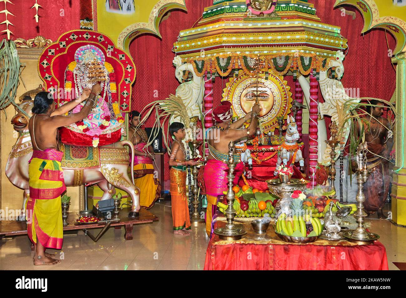 Tamil Hindu priests perform special prayers for Lord Ganesh and Lord Surya (the Sun God) during the Thai Pongal Festival at a Tamil Hindu temple in Ontario, Canada, on January 14, 2018. The Tamil festival of Thai Pongal is a thanksgiving festival honoring the Sun God and celebrating a successful harvest. (Photo by Creative Touch Imaging Ltd./NurPhoto) Stock Photo