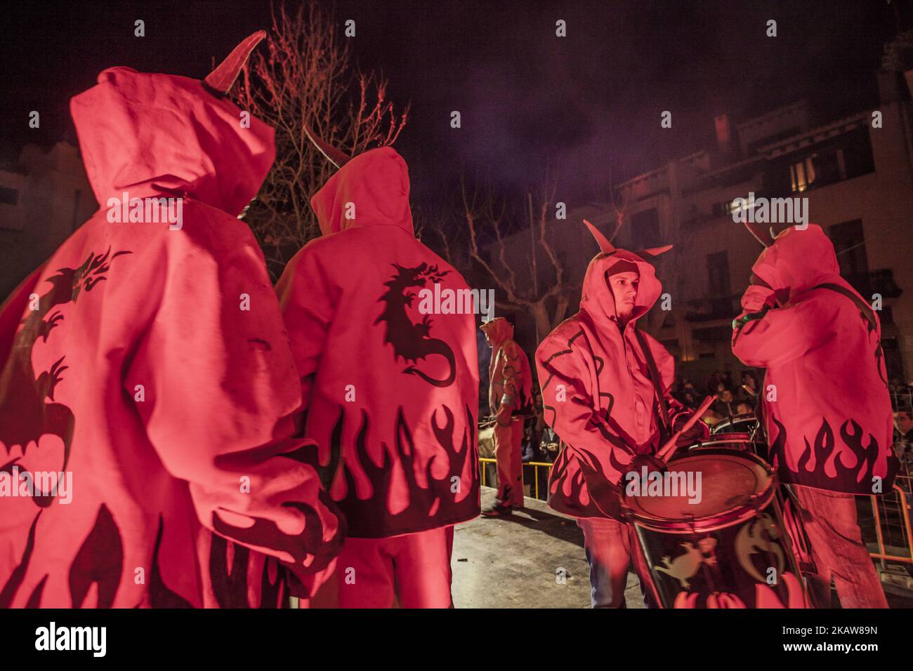 Participants of the 'Ball de Diables', dance of devils, with costumes during the celebrations of the 'Nit del Foc', night of fire, in the Vilaseca village, Spain, on January 20, 2018. (Photo by Celestino Arce/NurPhoto) Stock Photo