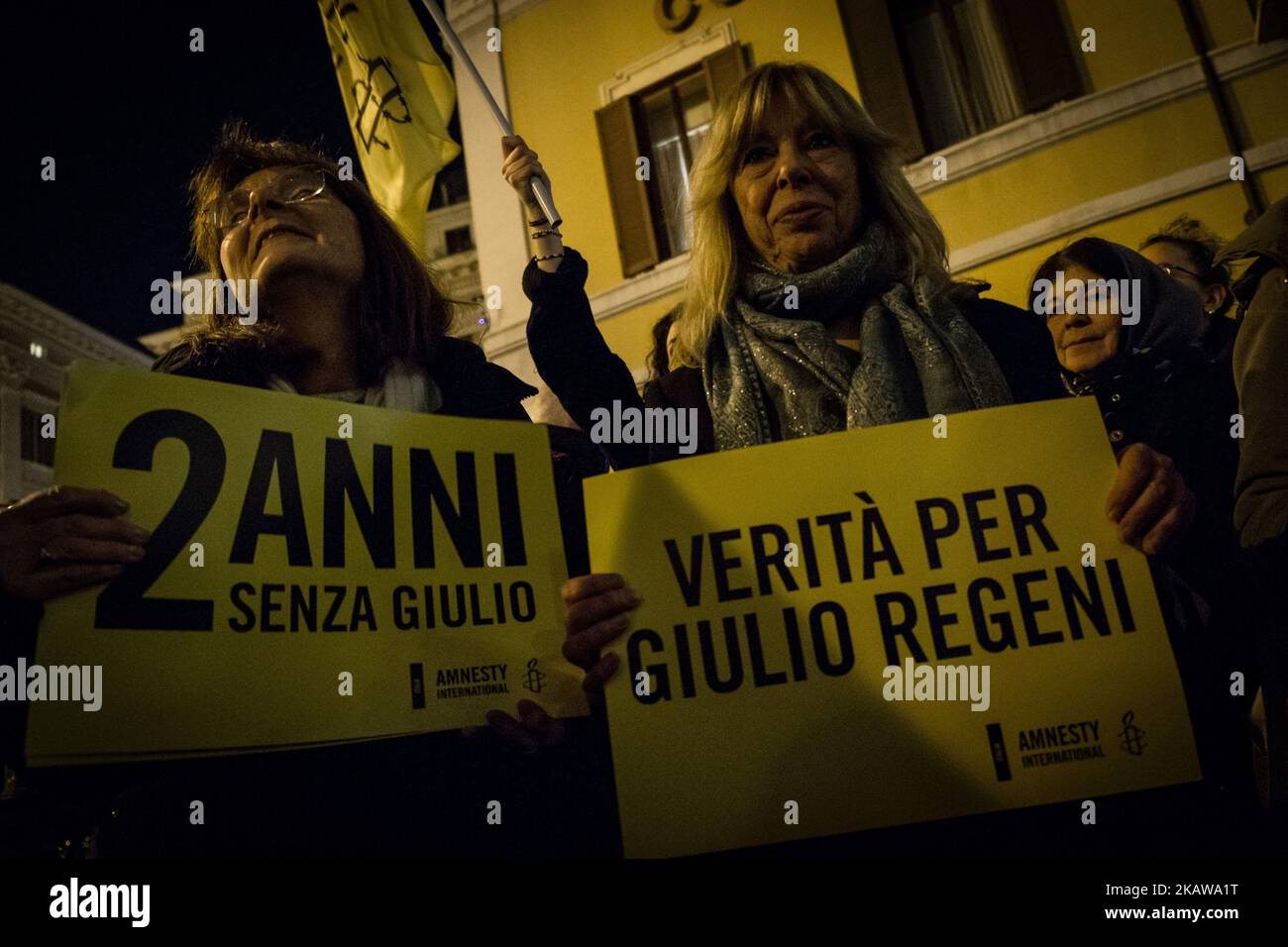 People during a march and torchlight procession in memory of the