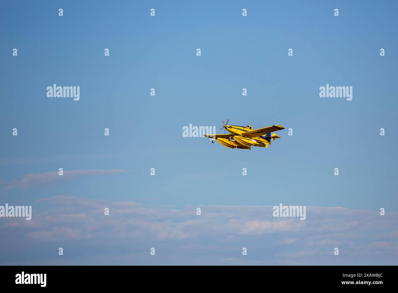 A yellow jet in a flight Stock Photo